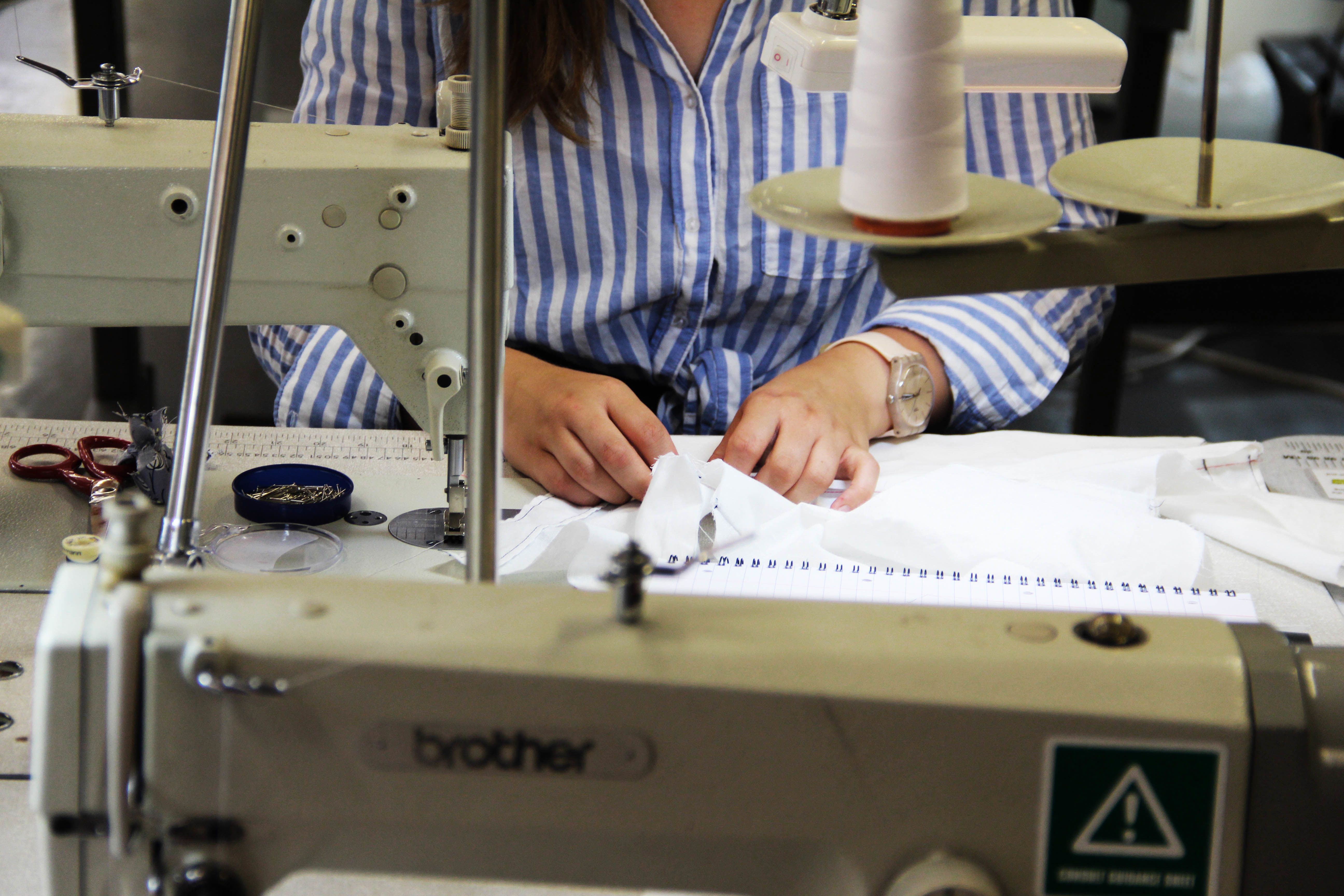 Image of student working on a sewing machine