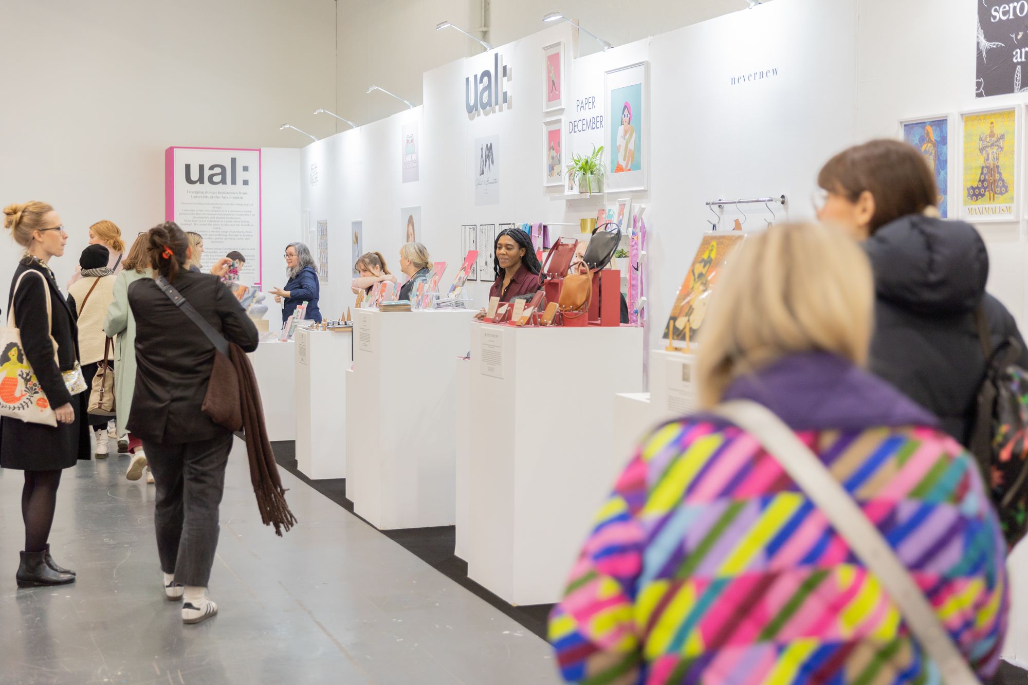 people viewing stalls at a trade show