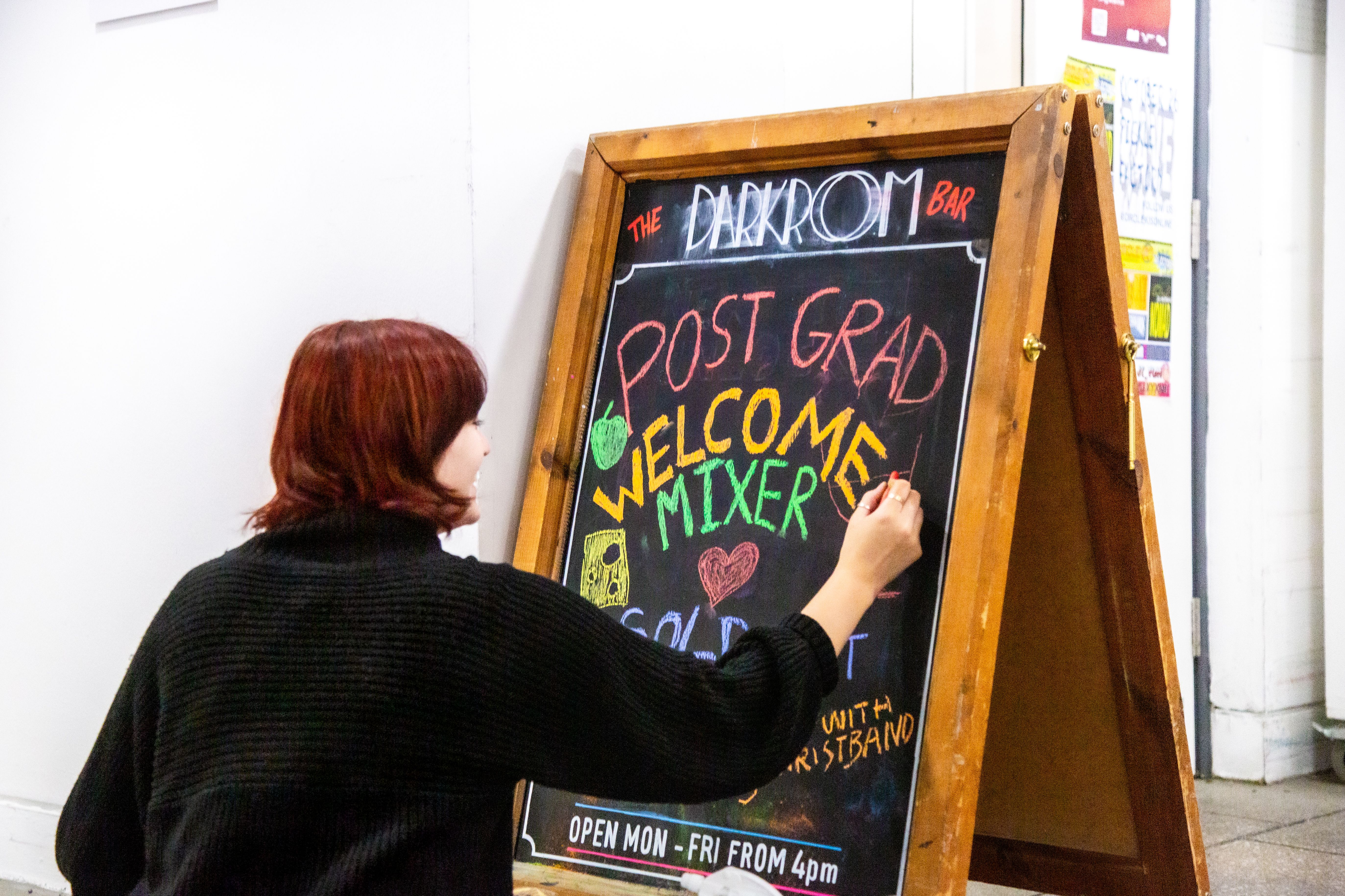 Drawing details of the event on the notice board