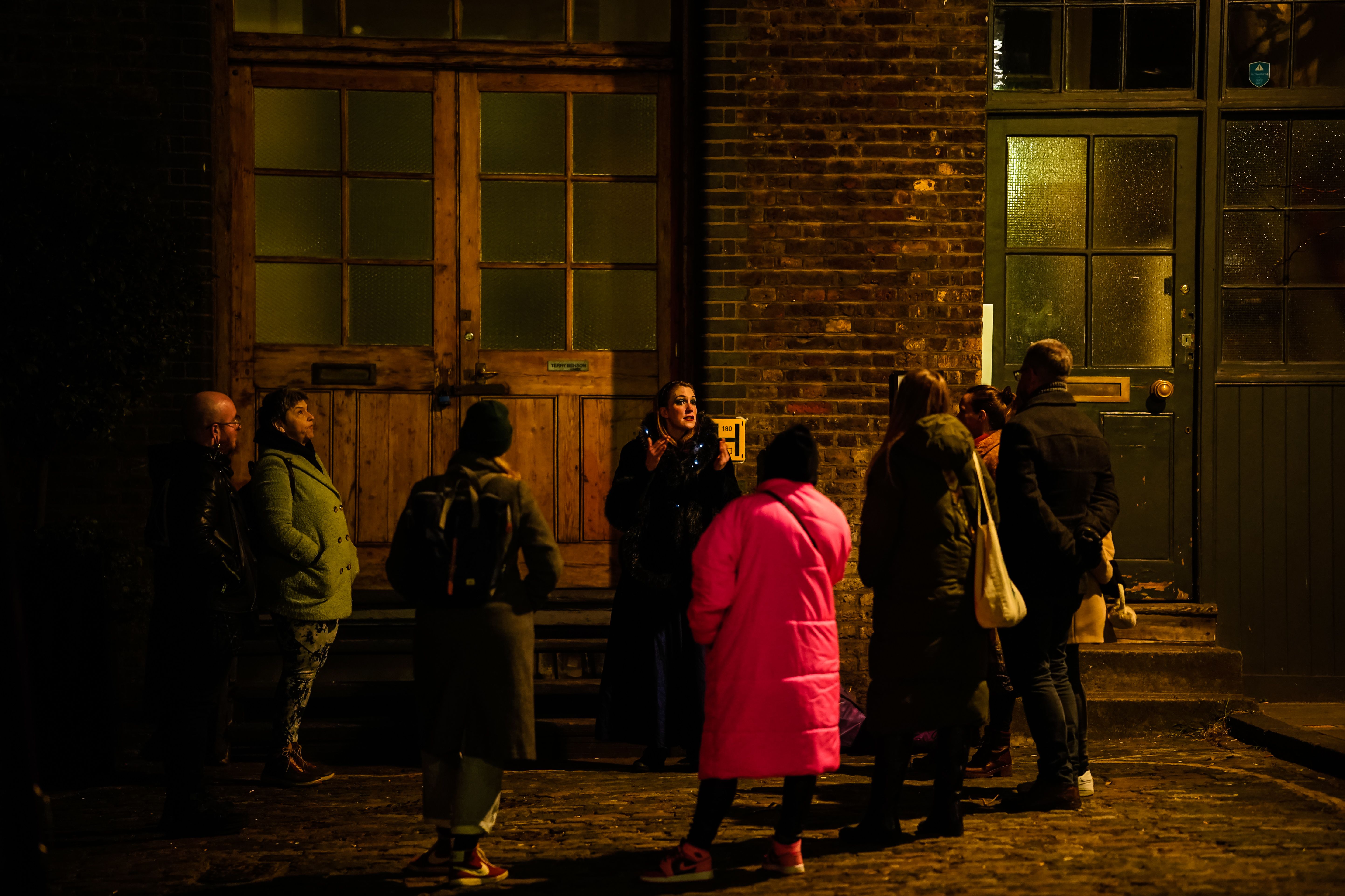 Group of people stood outside talking
