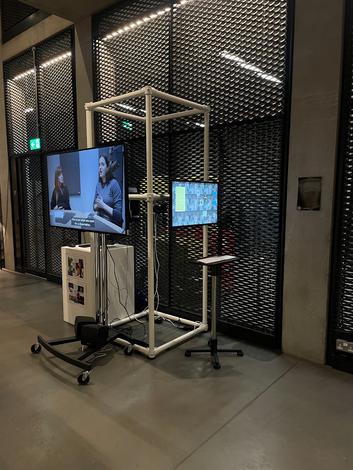 Gallery view of tv screen mounted on metal stand