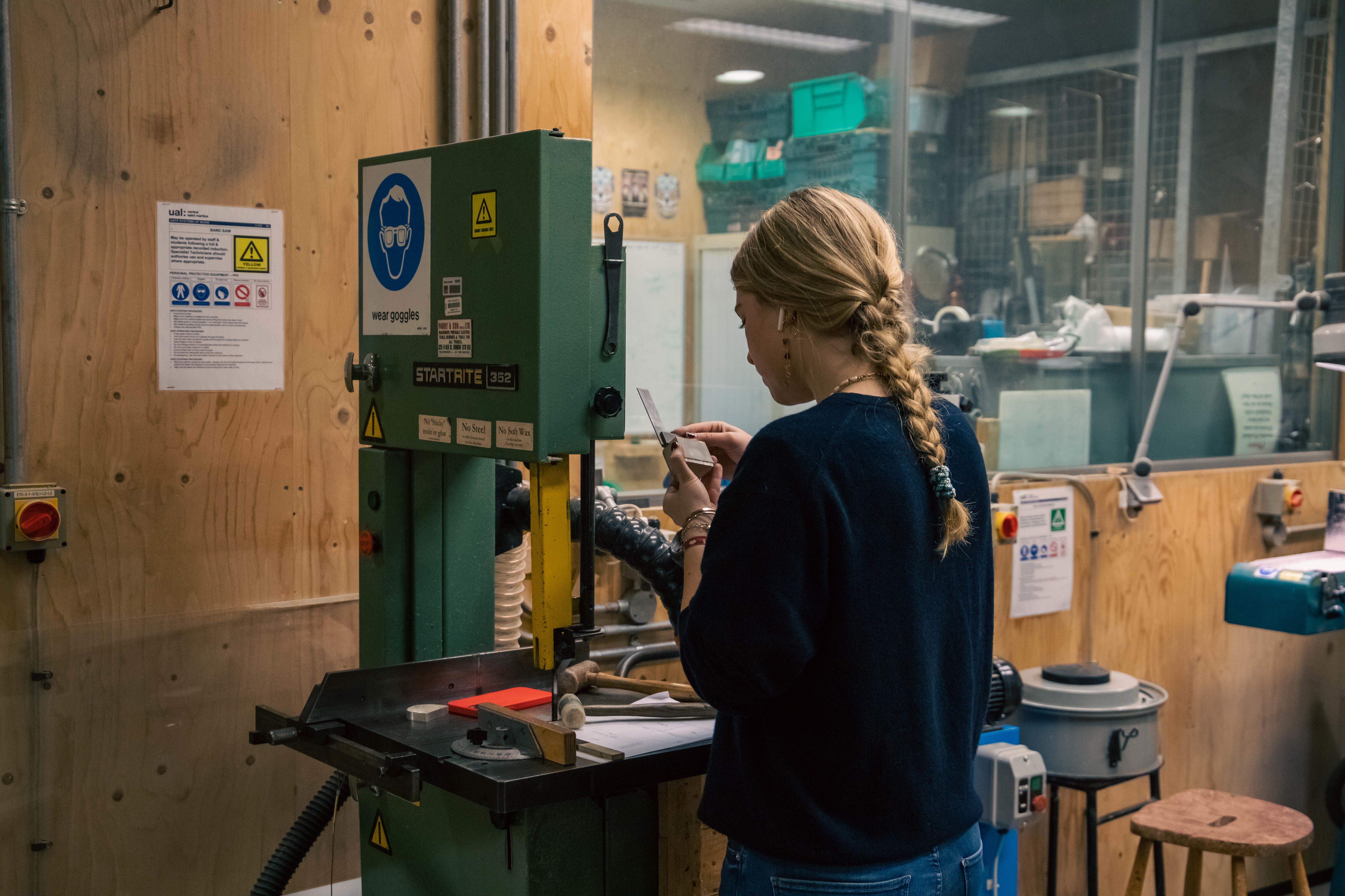 Iona Farrell working at a silver workshop