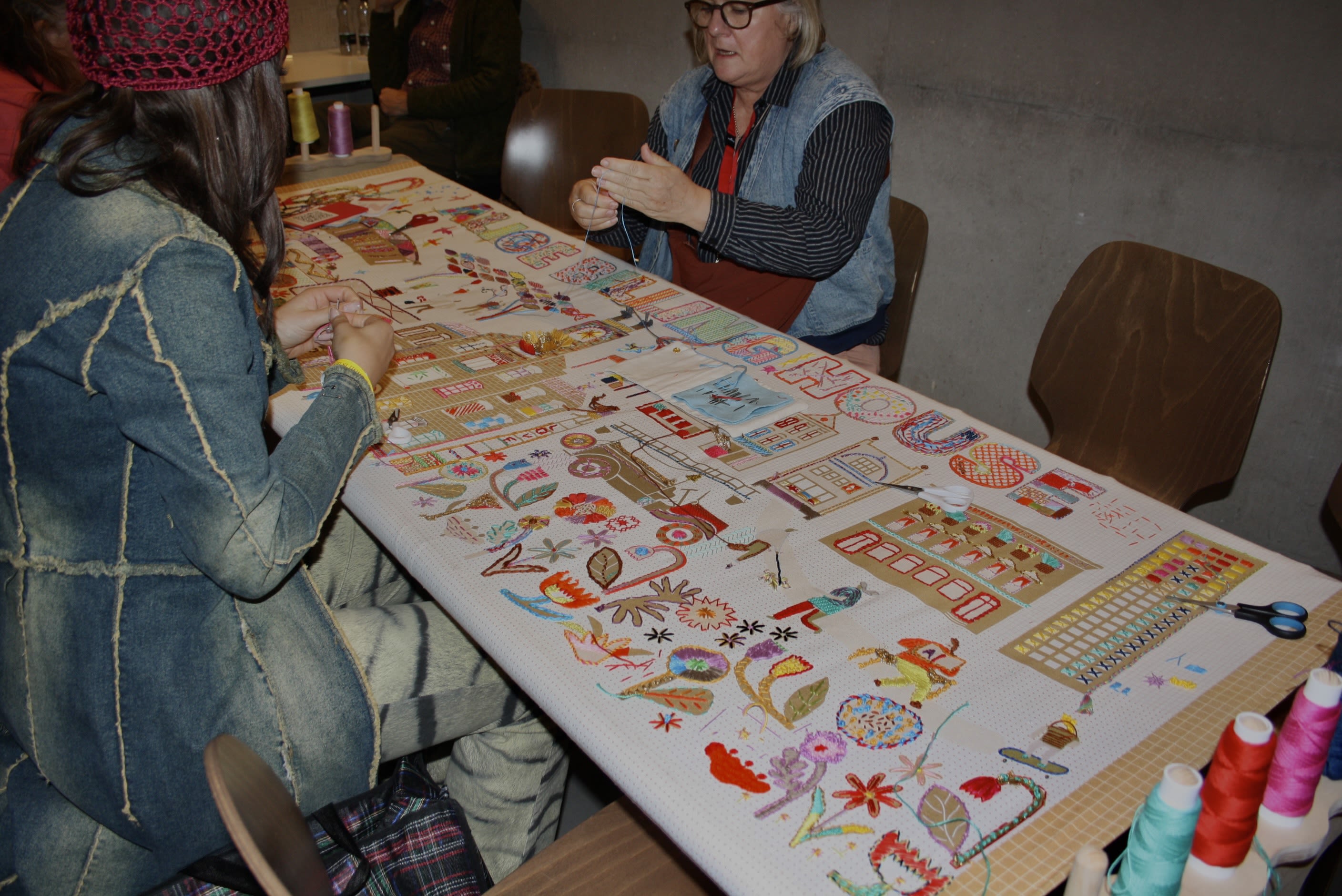 Table with stitching and patterns embroidered on.