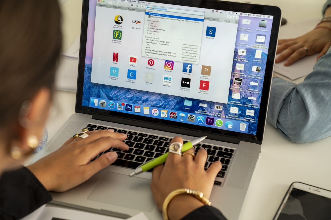 Woman typing on laptop