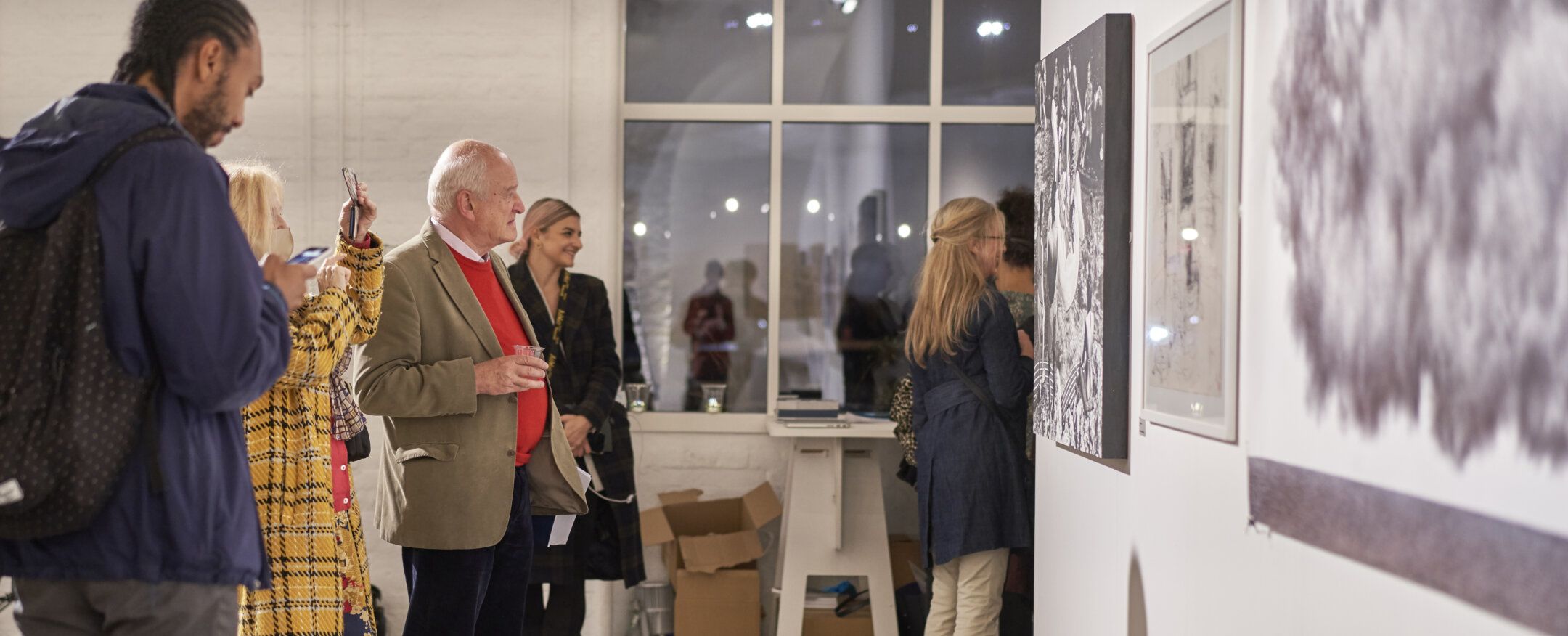 Visitors looking at an exhibition
