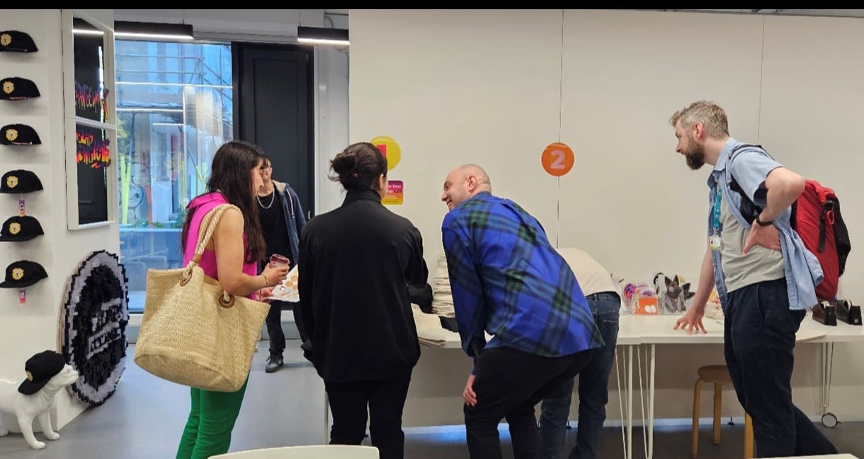 People standing around a table at the pop-up shop