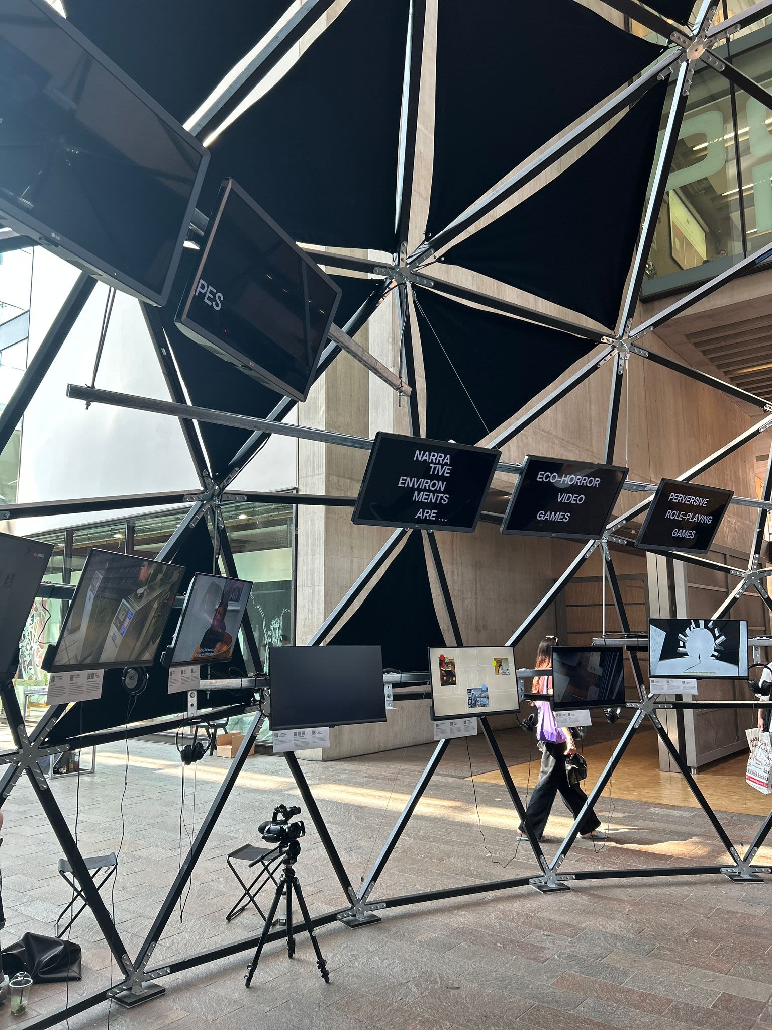 Metal sphere structure with screens in Central Saint Martins