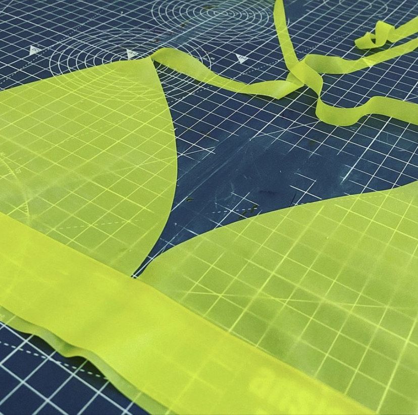 A fabric cut out of a neon green bra