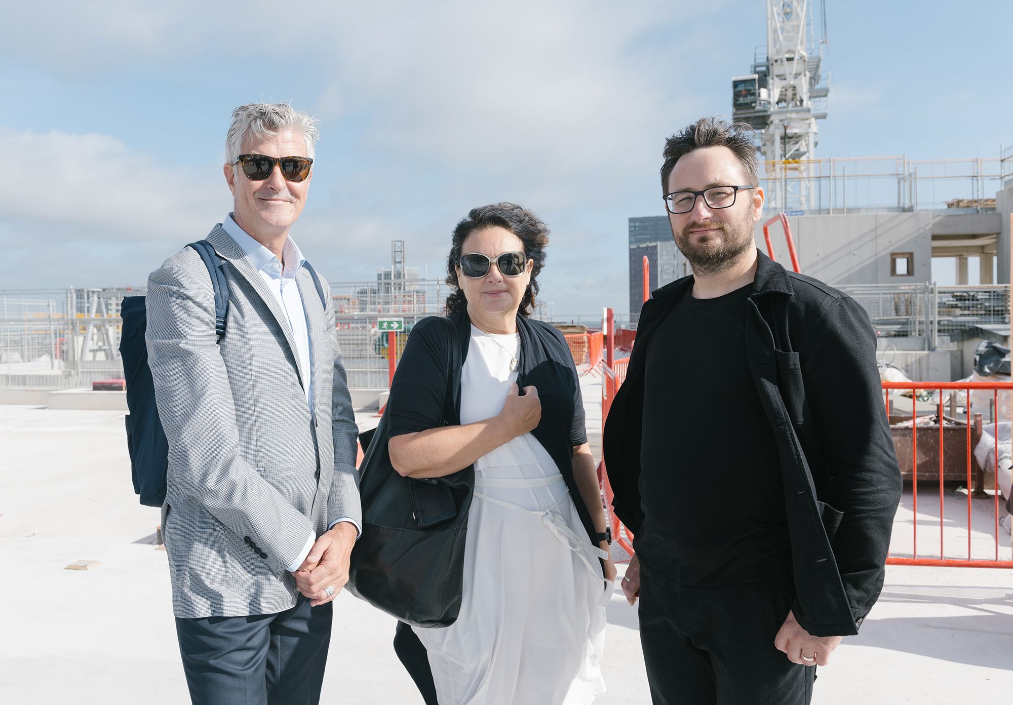 An image of Gavin Jenkins, José Teunissen and Andrew Teverson at the topping out of LCF’s new building at the Olympic Park