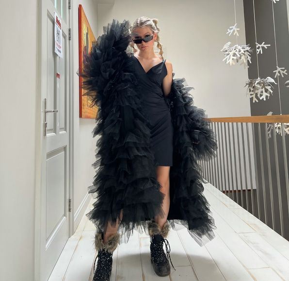 Liva Majore wearing the tulle coat she designed