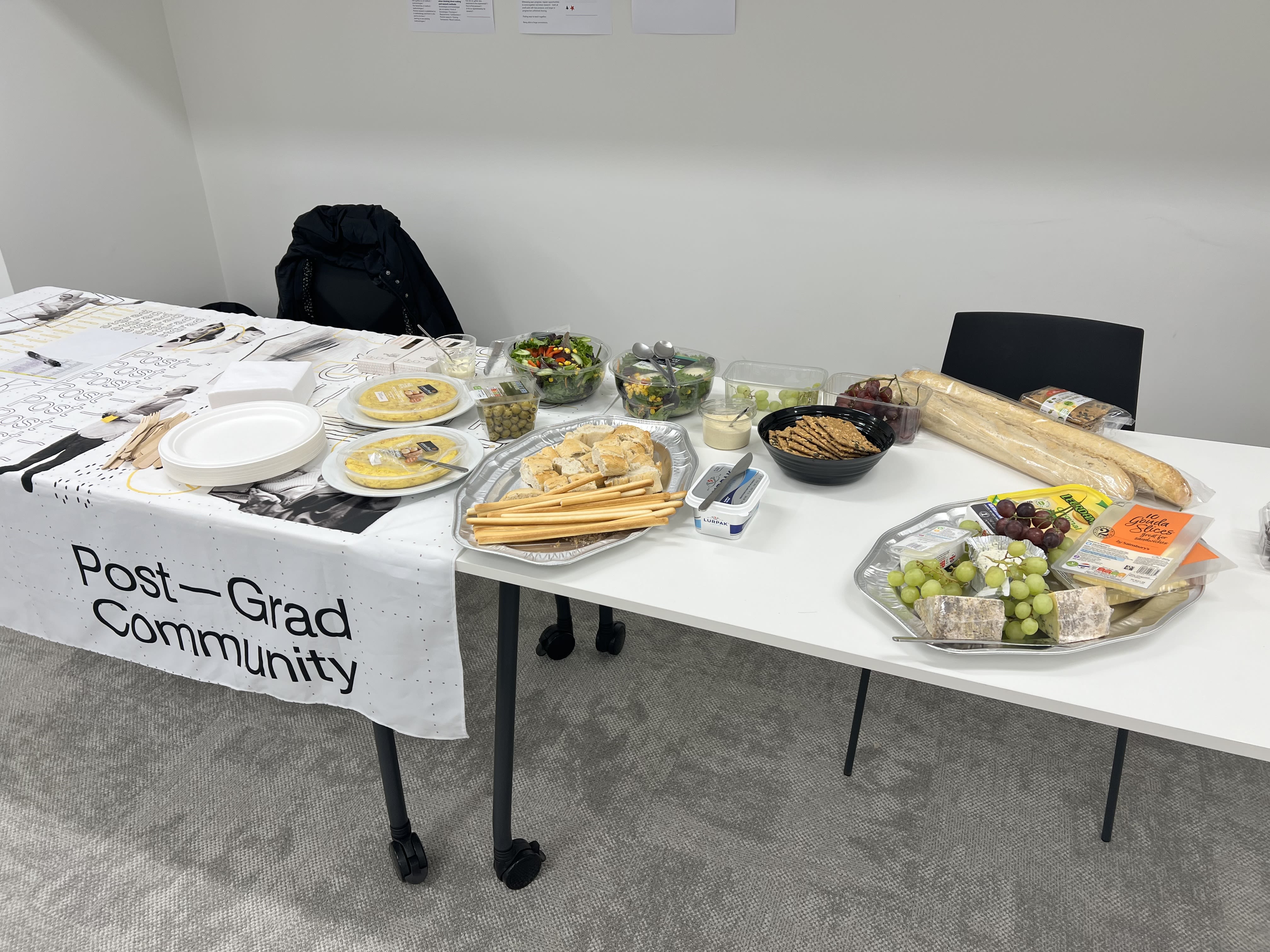 food laid across a branded post-grad community tablecloth