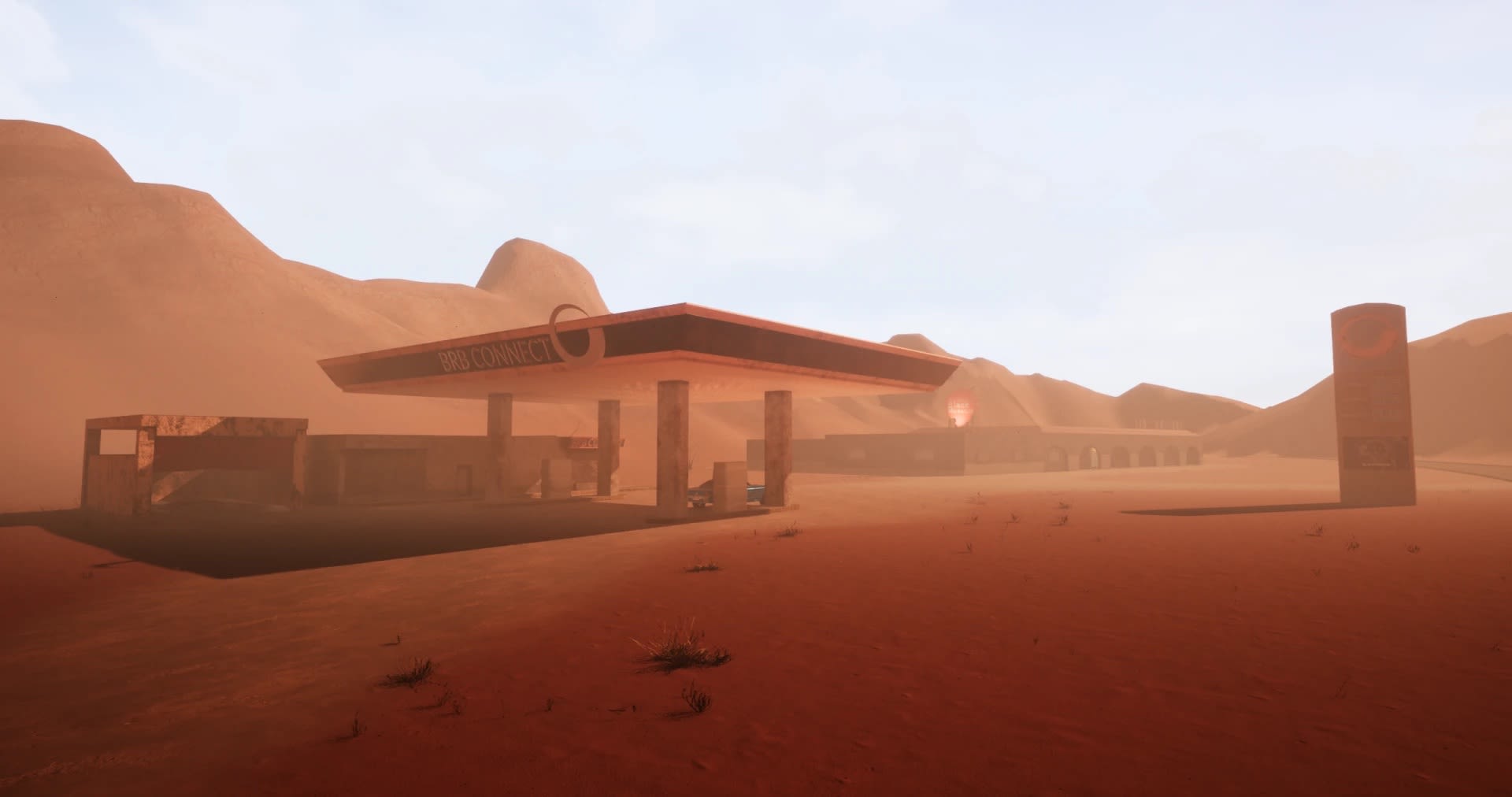 Gaming still of an abandoned petrol station amidst a lifeless desert