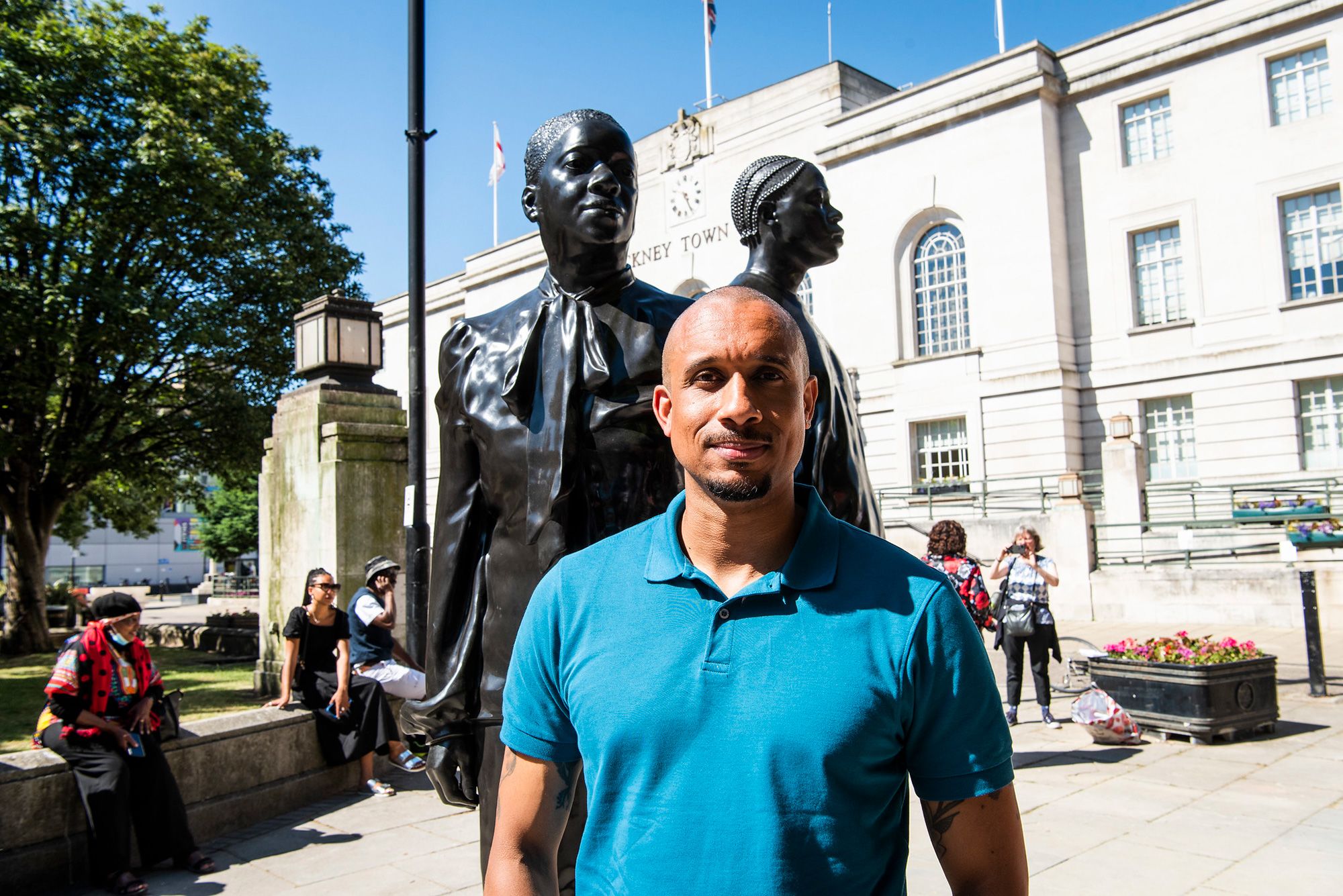 Thomas J Price in front of his sculpture