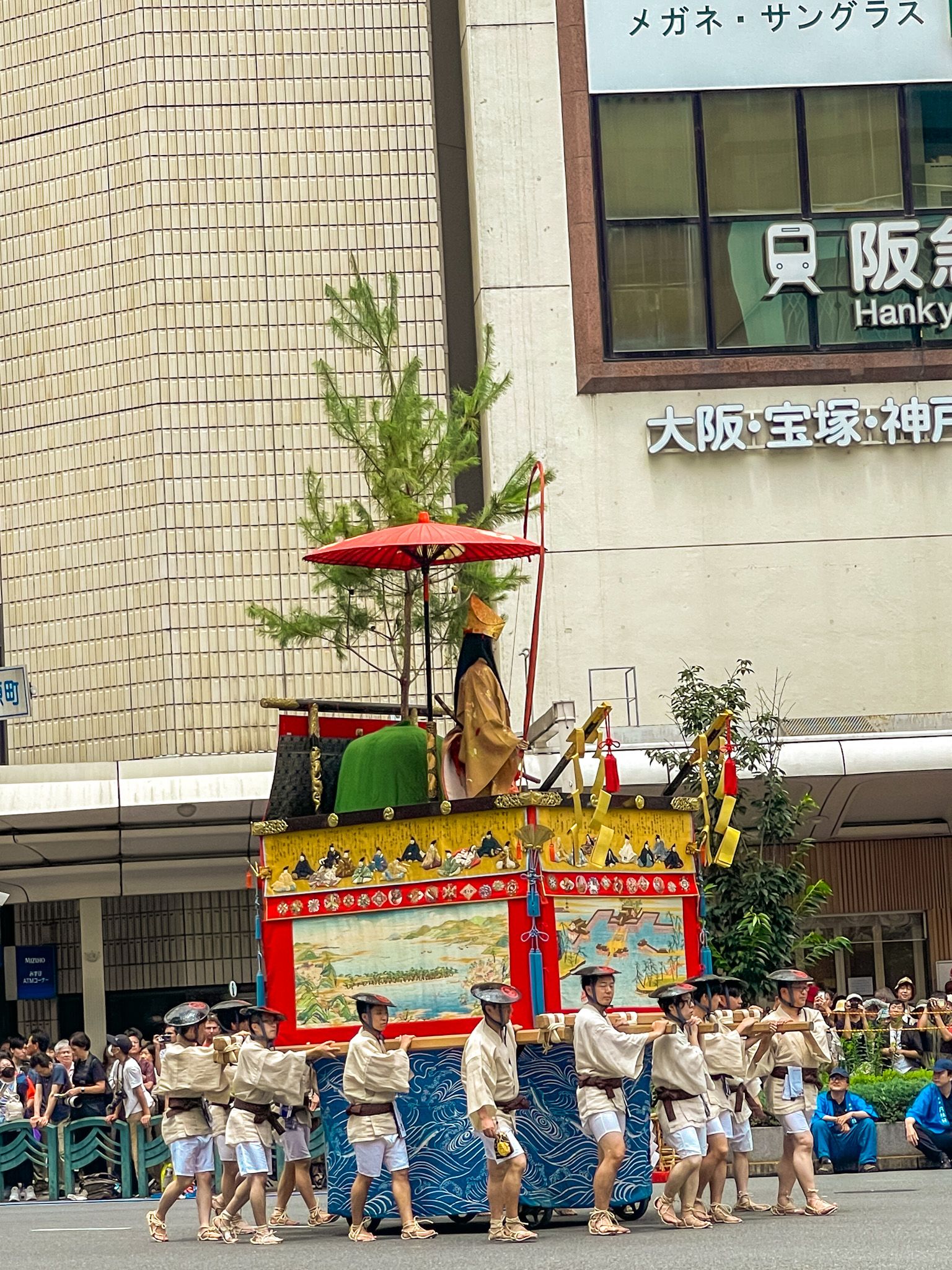 A Yama float carried by a group of men.