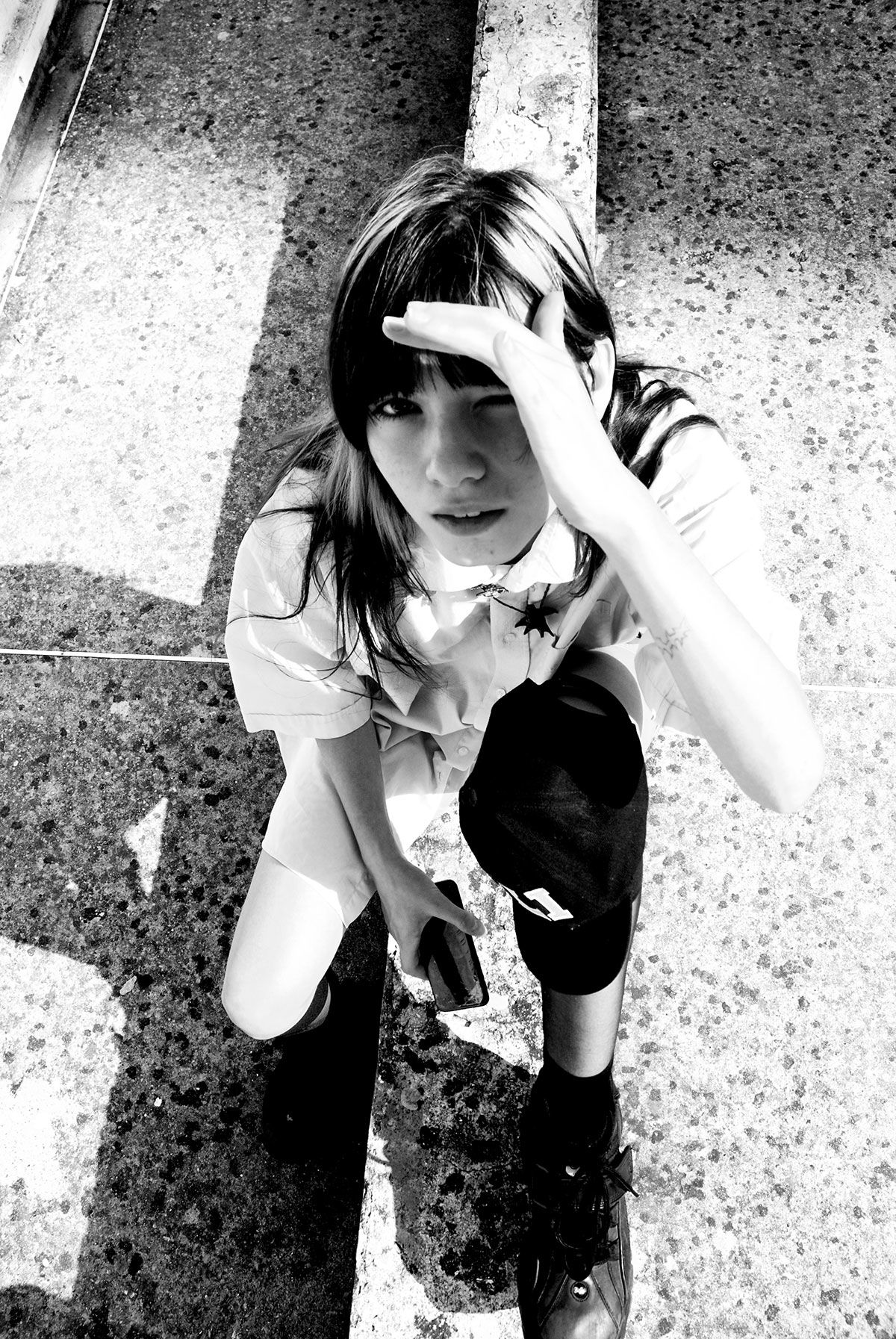 Greyscale photograph of a person looking up.