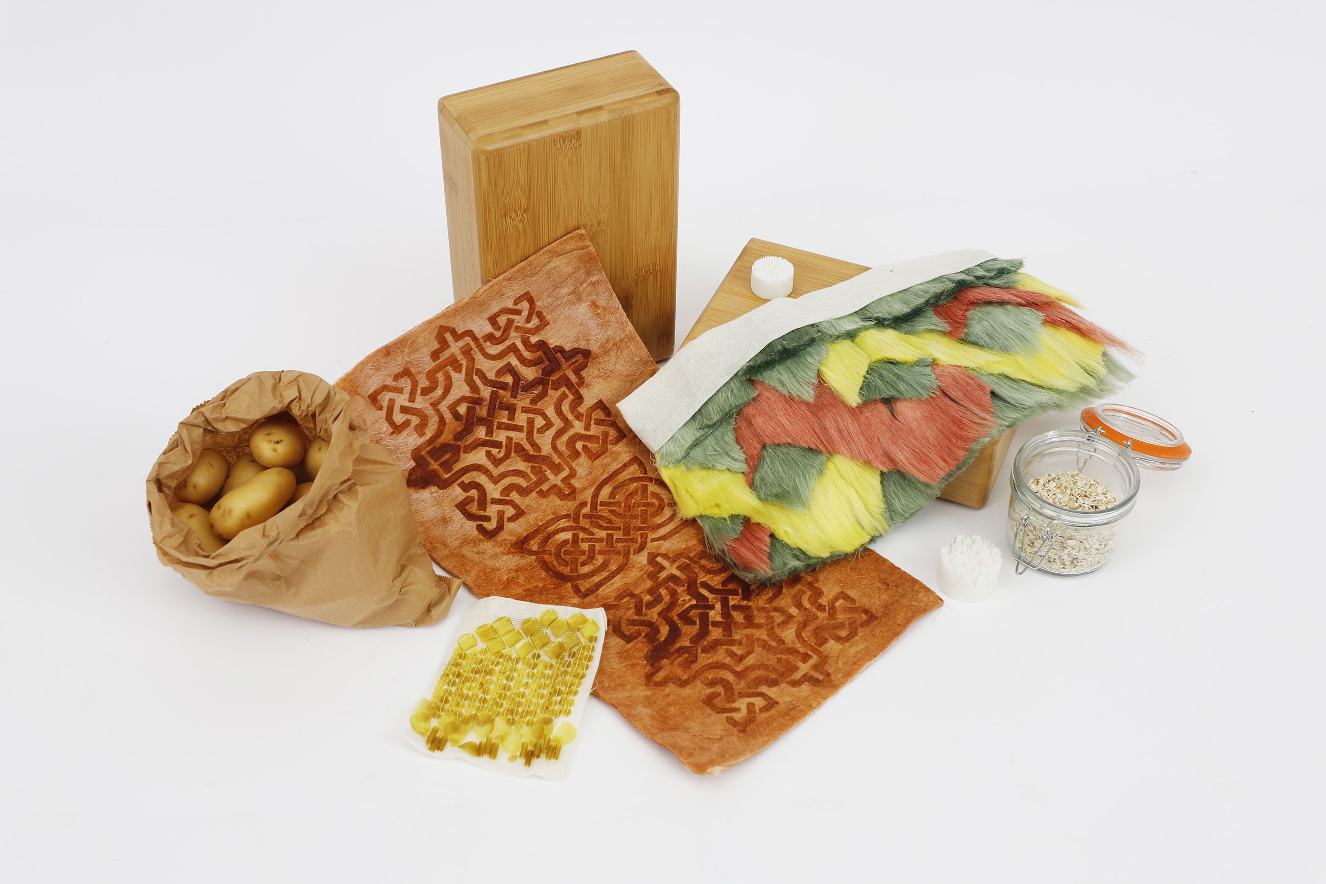 a variety of objects including potatoes and oats against a white background