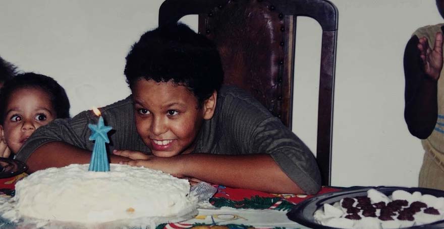 Two children sit at a table