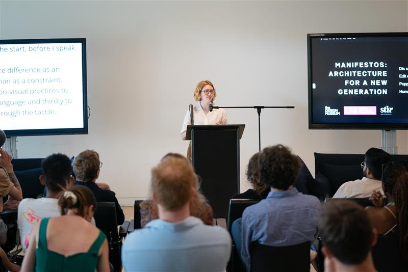 Poppy Levison addressing an audience 