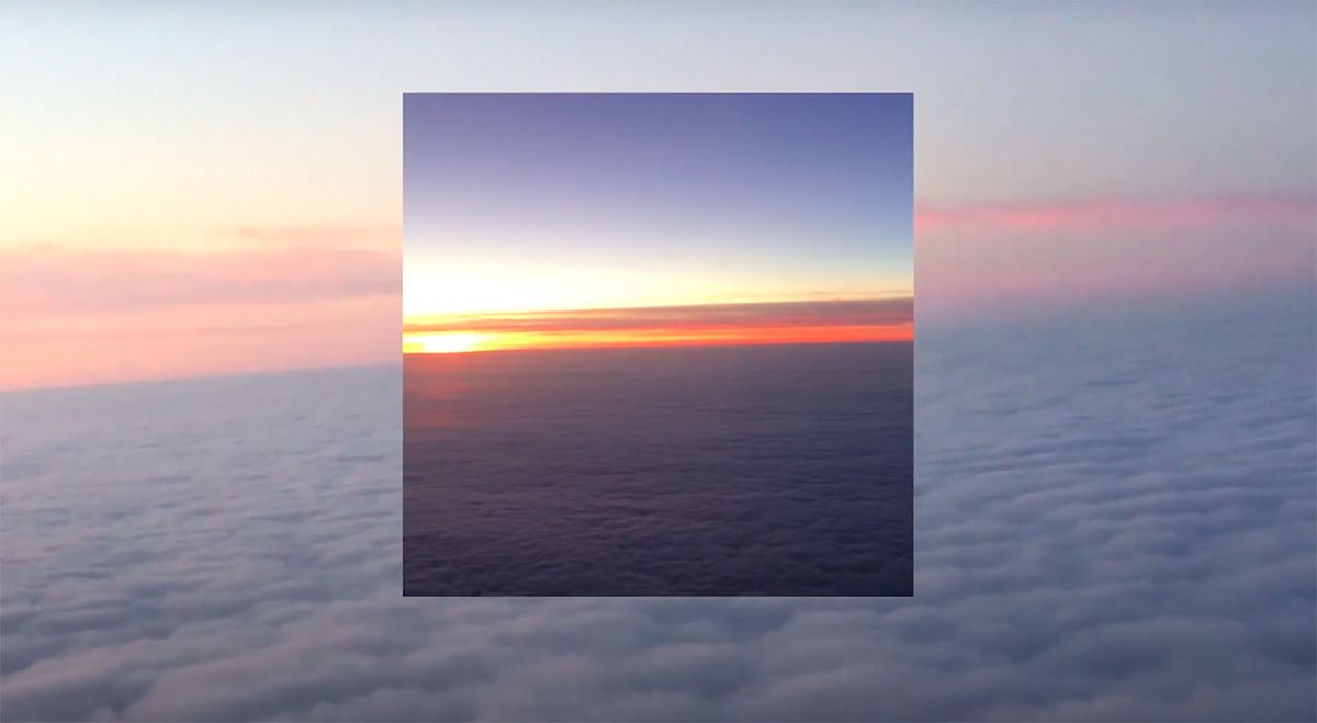 A still from a music video featuring a collage-effect sky.