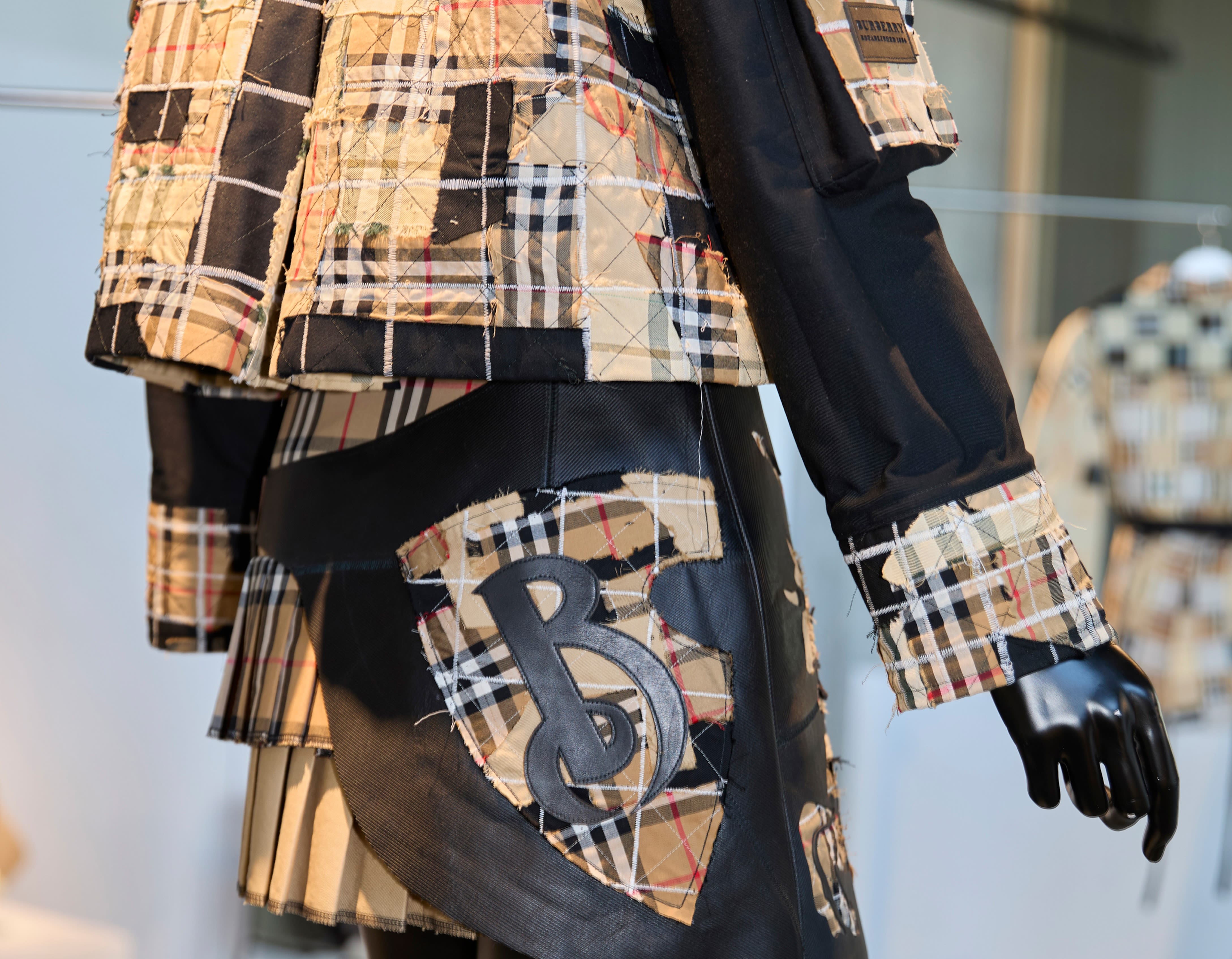 Mannequin with blazer and skirt on.