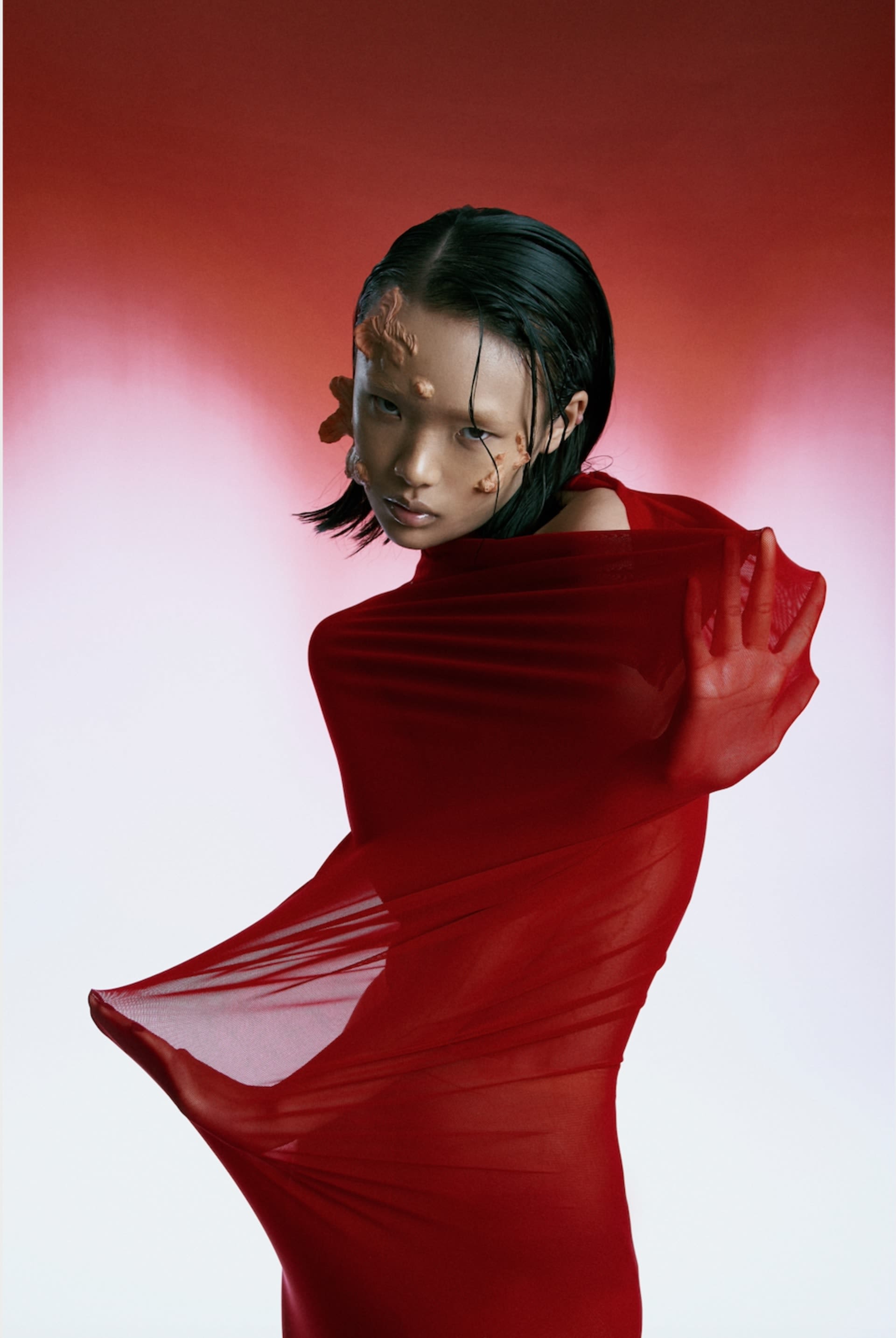 Model wearing a red outfit