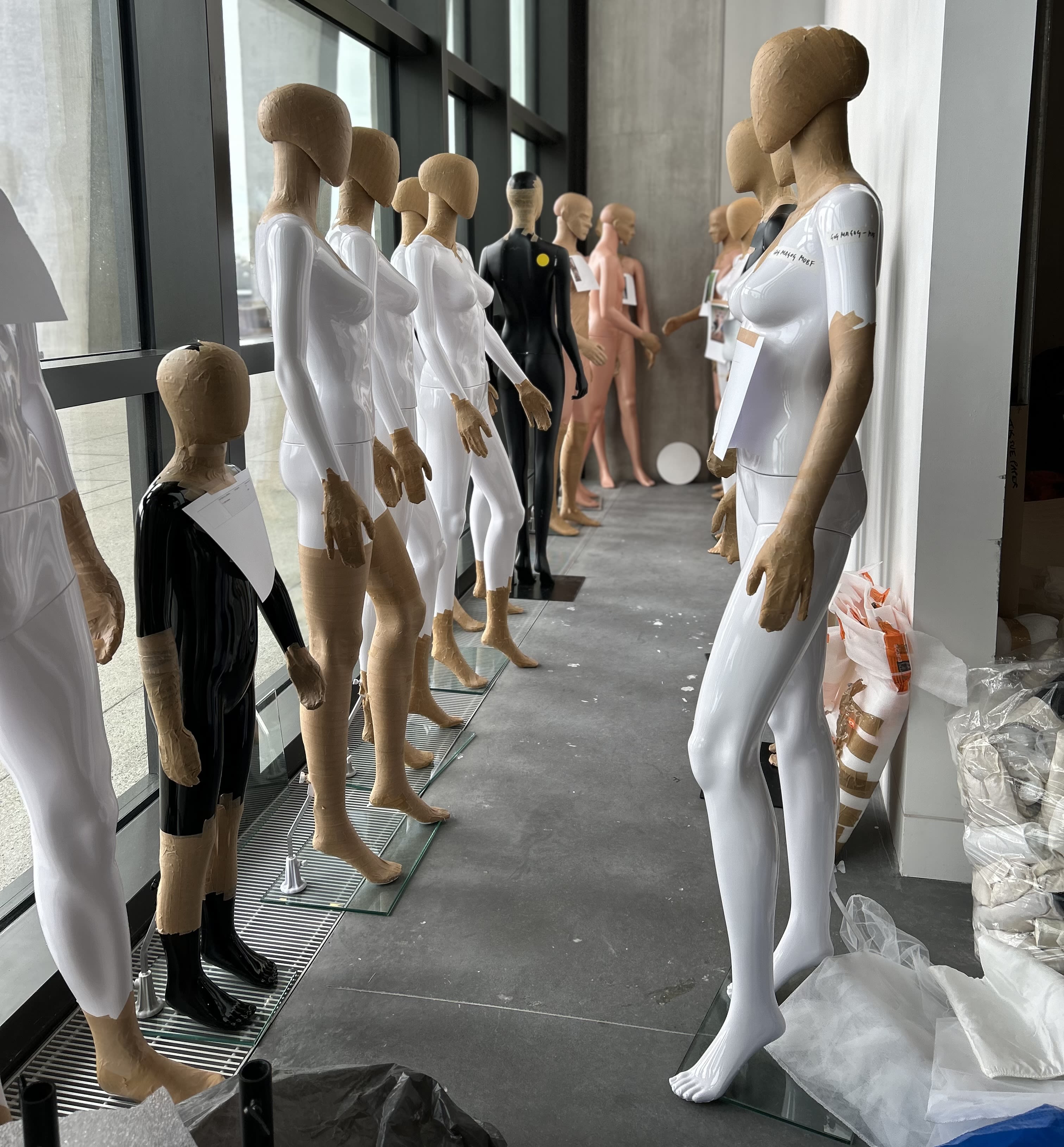 undressed mannequins in a row