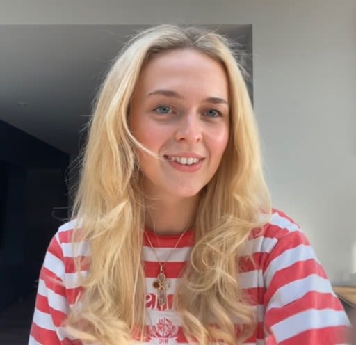 Selfie of Mollie wearing a striped long-sleeved top