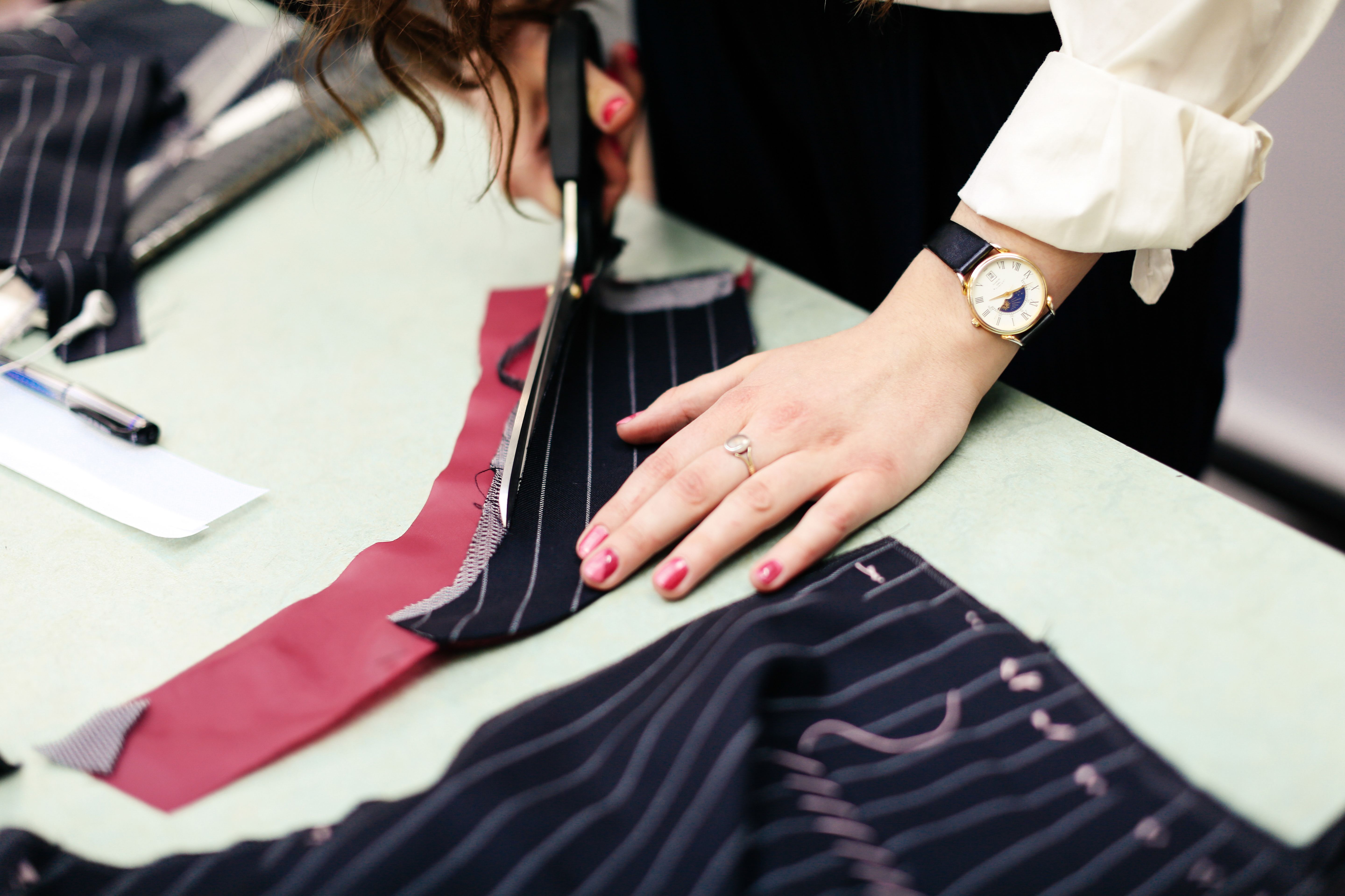 Image of a person cutting out fabric