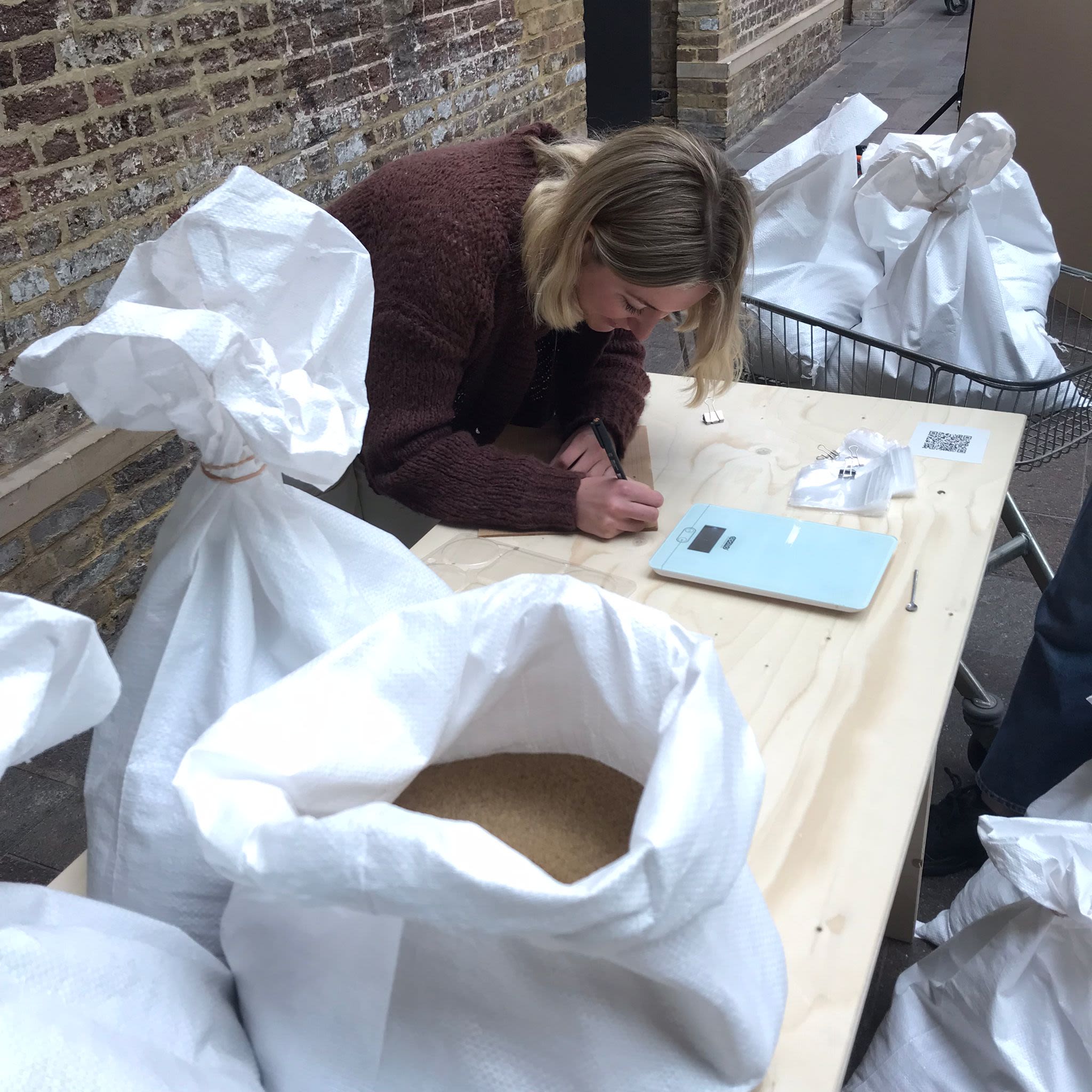 Rebecca Faulkner at her installation, Shifting Sands, Migrating Grains