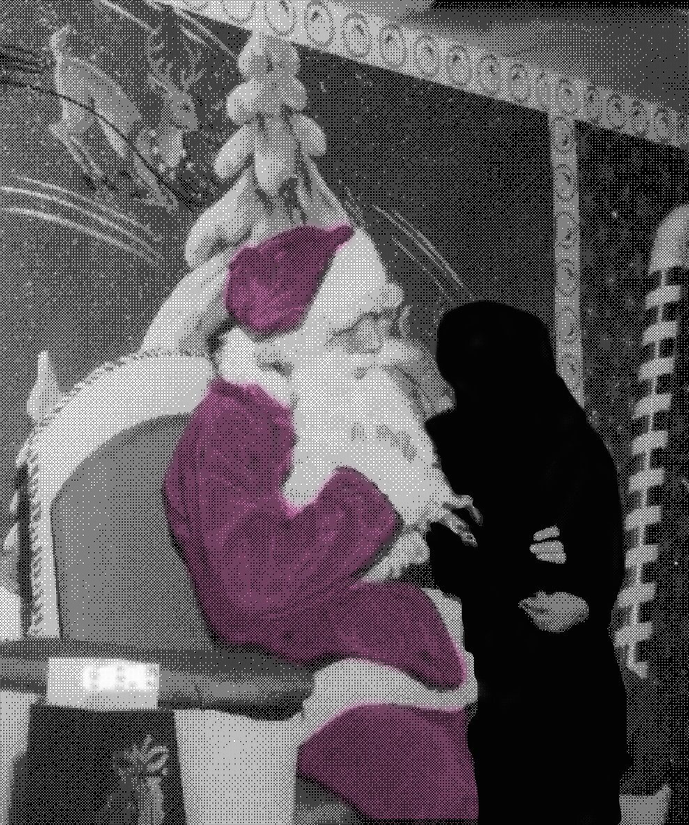 A pixellated image of Santa with a person-shaped cutout overlaid
