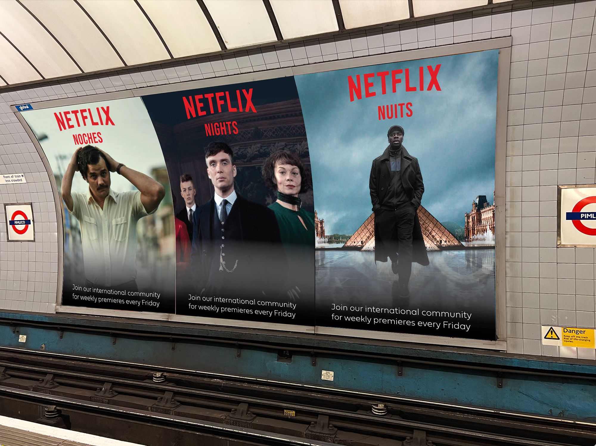 Three large posters with the word NETFLIX and images of actors underneath are on a poster wall in Pimlico tube station. Underneath each word ‘NETFLIX’ the first poster has ‘NOCHES’, the second ‘NIGHT’ and the third ‘NUITS’. At the bottom of the posters the text ‘Join our international community for weekly premieres every Friday’ is written. 