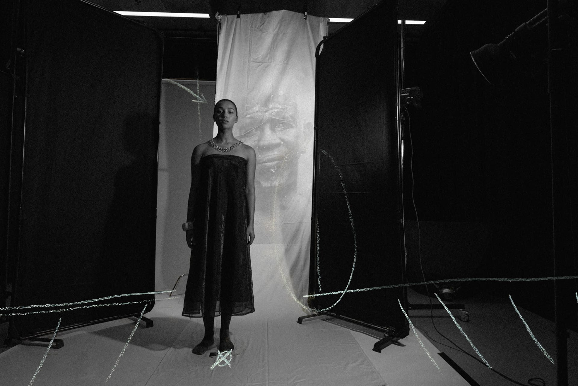 A woman standing in front of screen