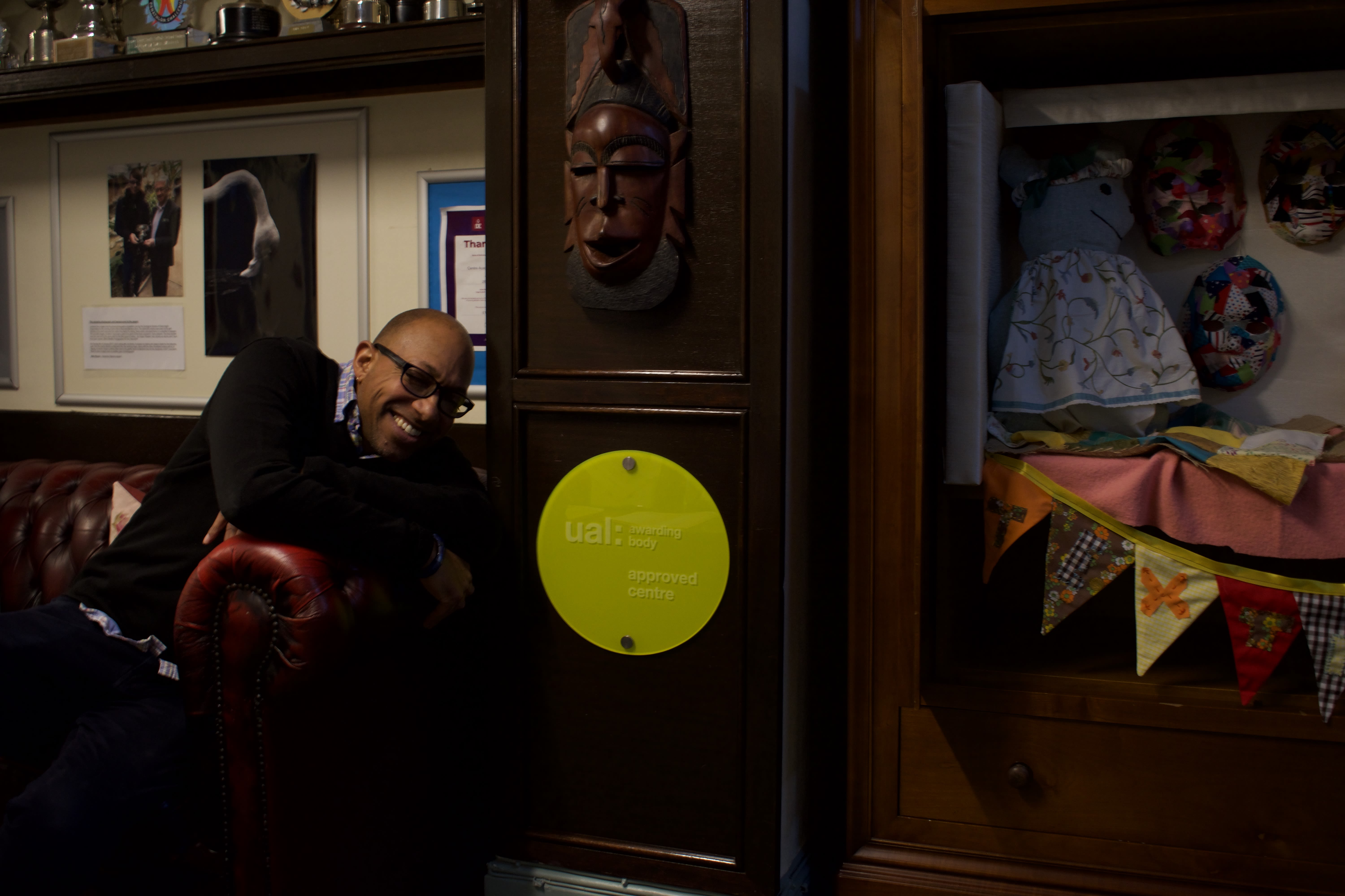 An image of course leader with UAL Awarding Body plaque at Centre Academy East Anglia.