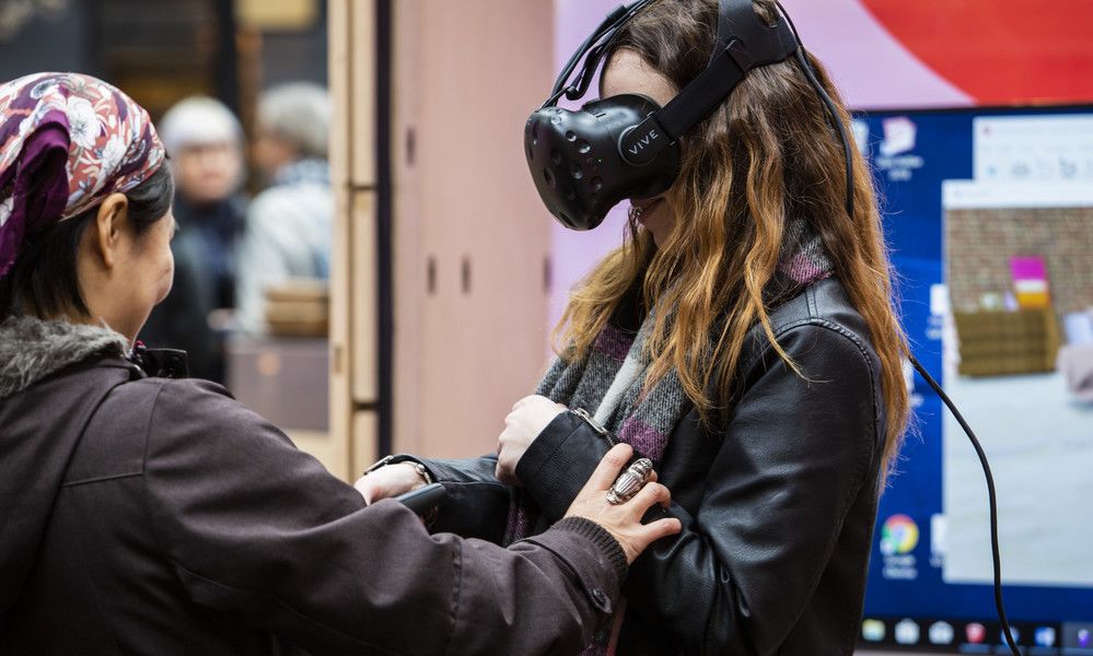 People using VR headsets at Fashion Means Business 19 by Fashion Innovation Agency at Spitalfields Market. Photography, Katy Davies.