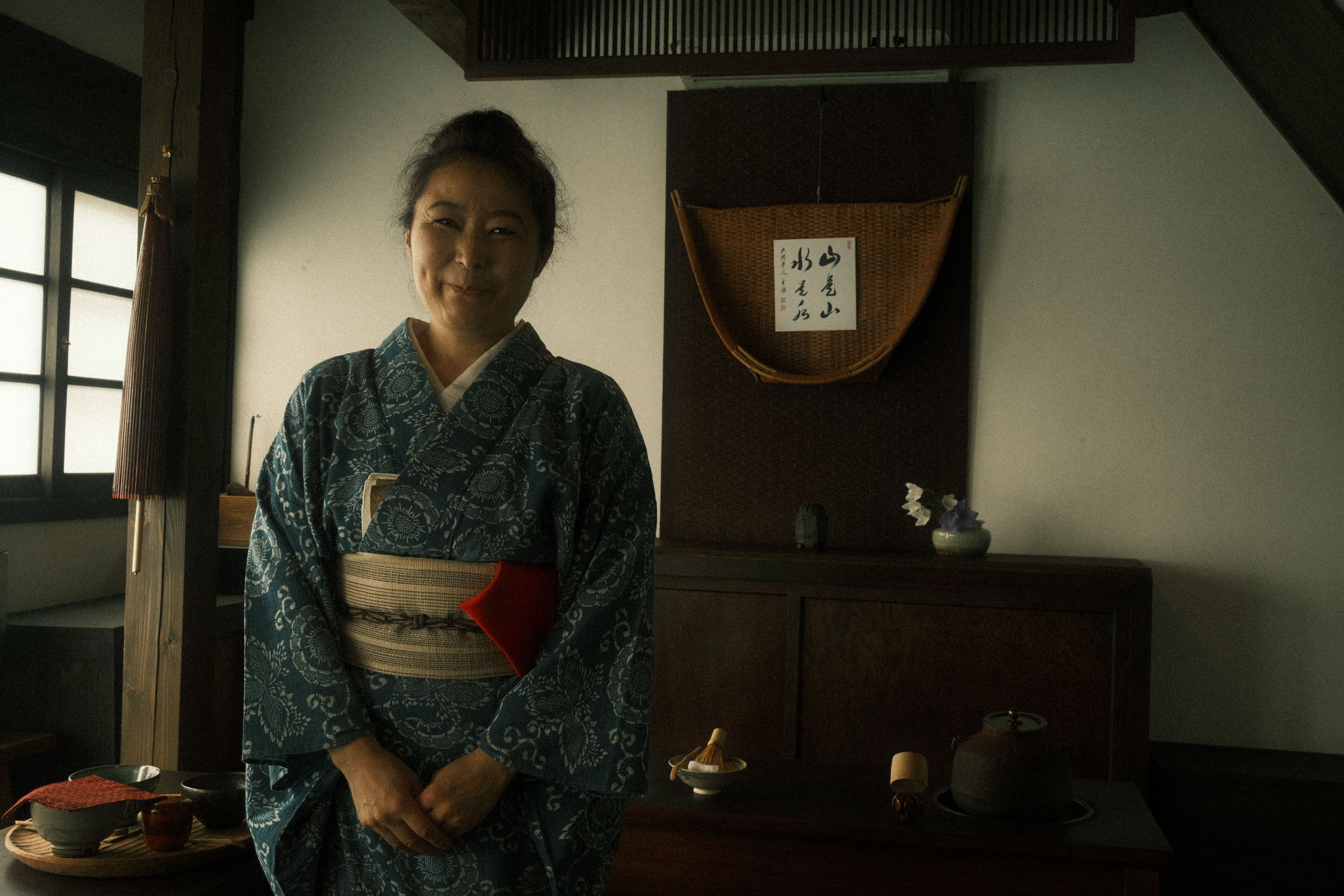 a japanese woman smiling at the camera