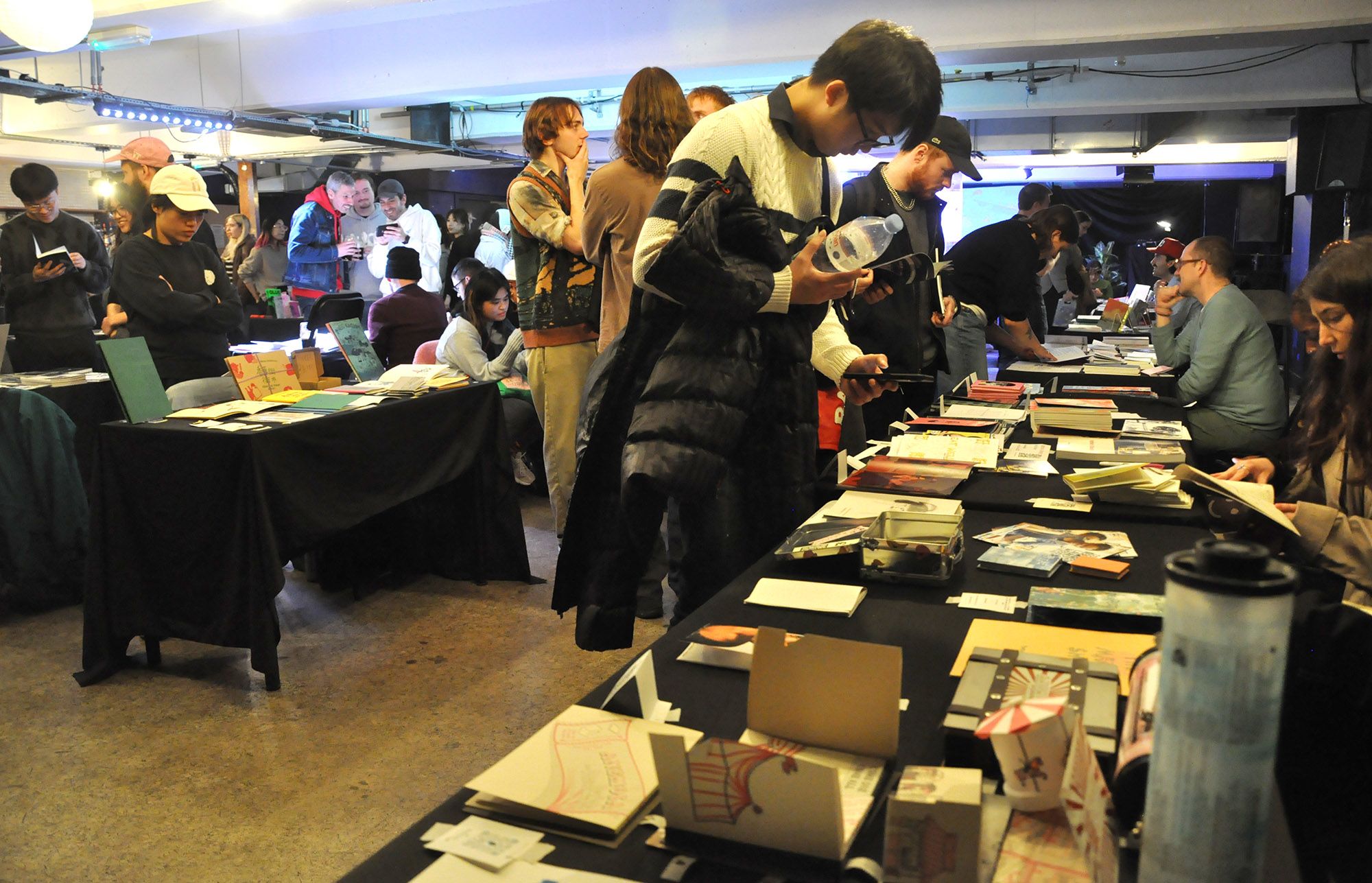 People at a zine fair