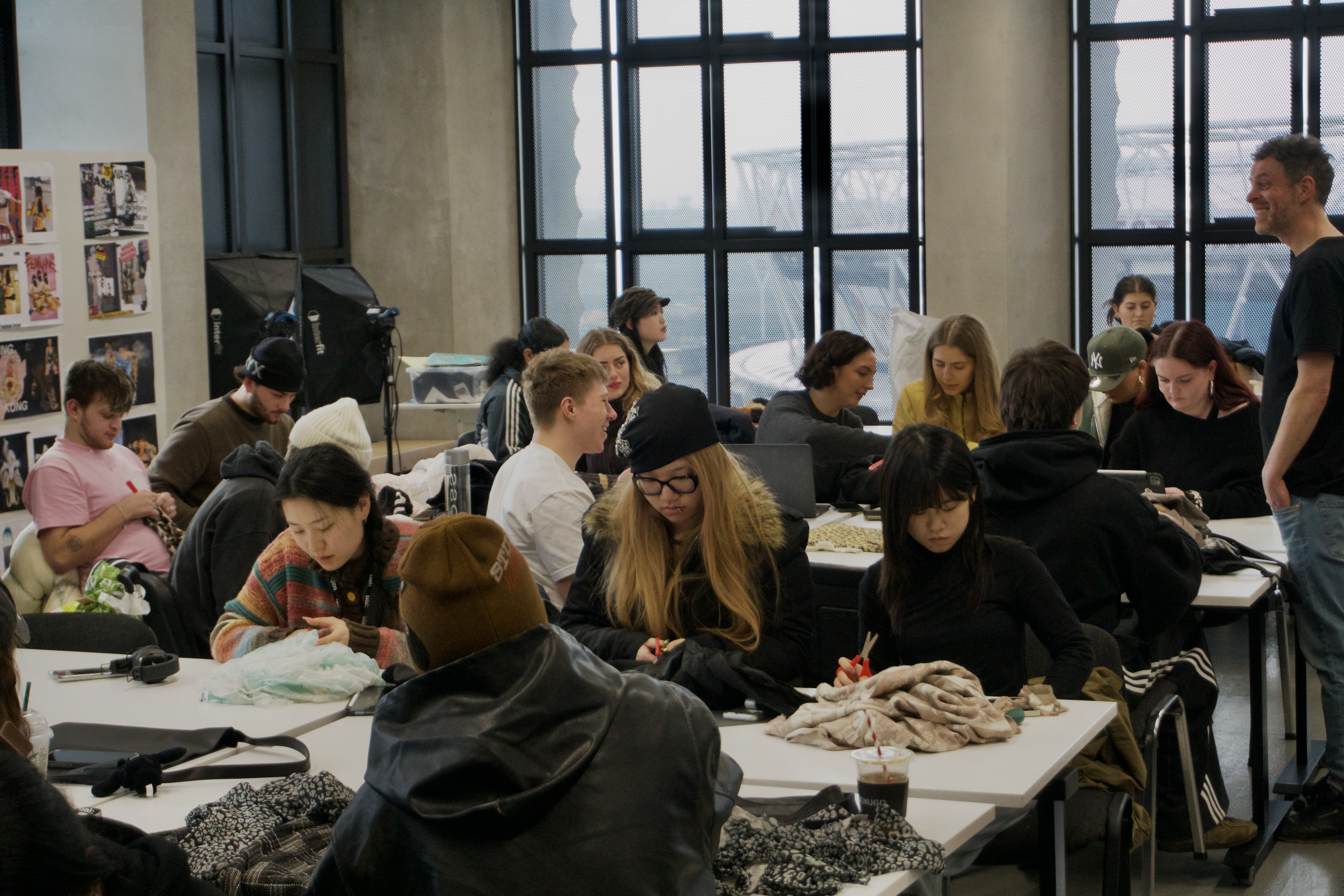 Students sat around a table in a classroom.