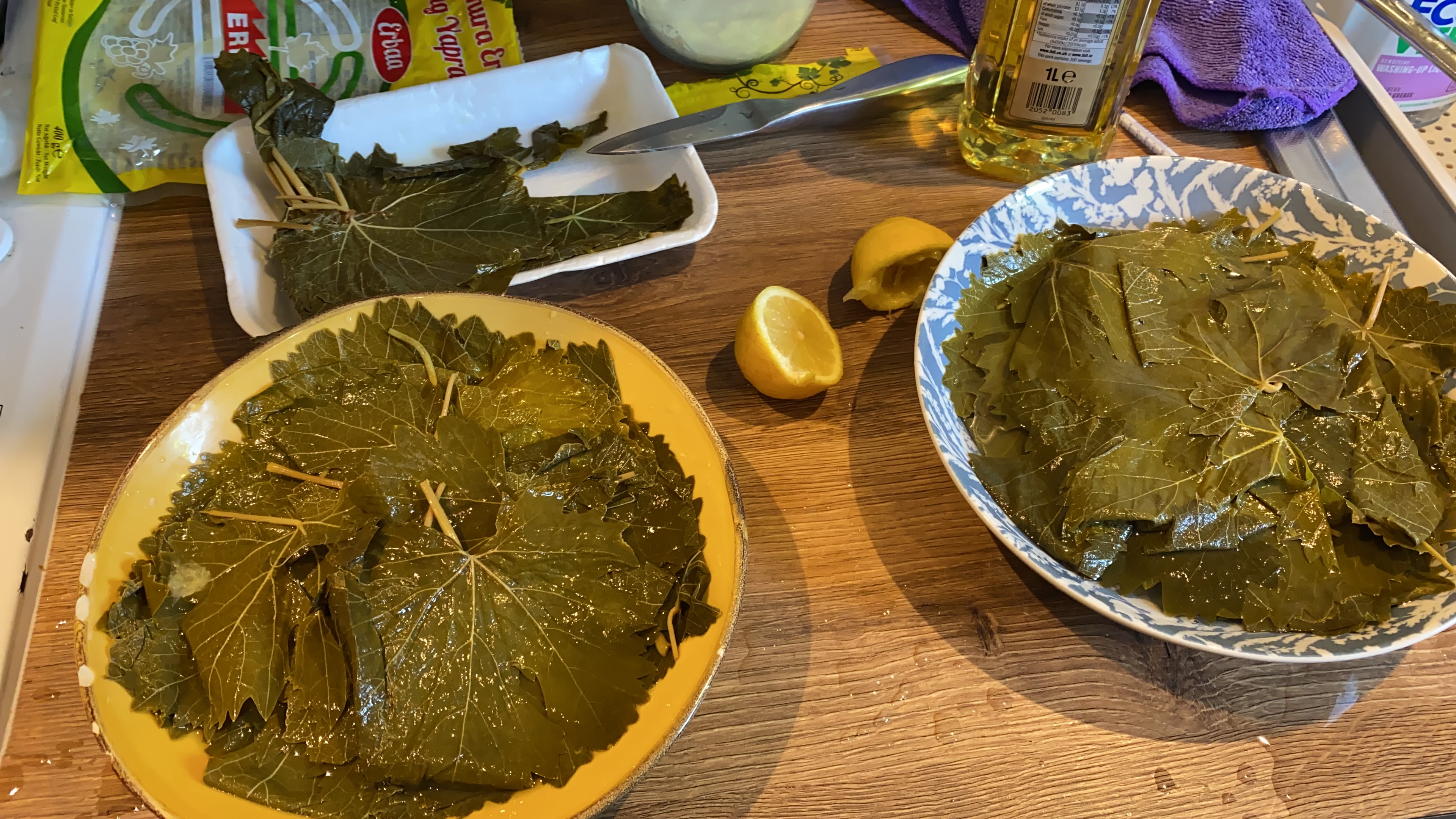 Two bowls filled with vine leaves