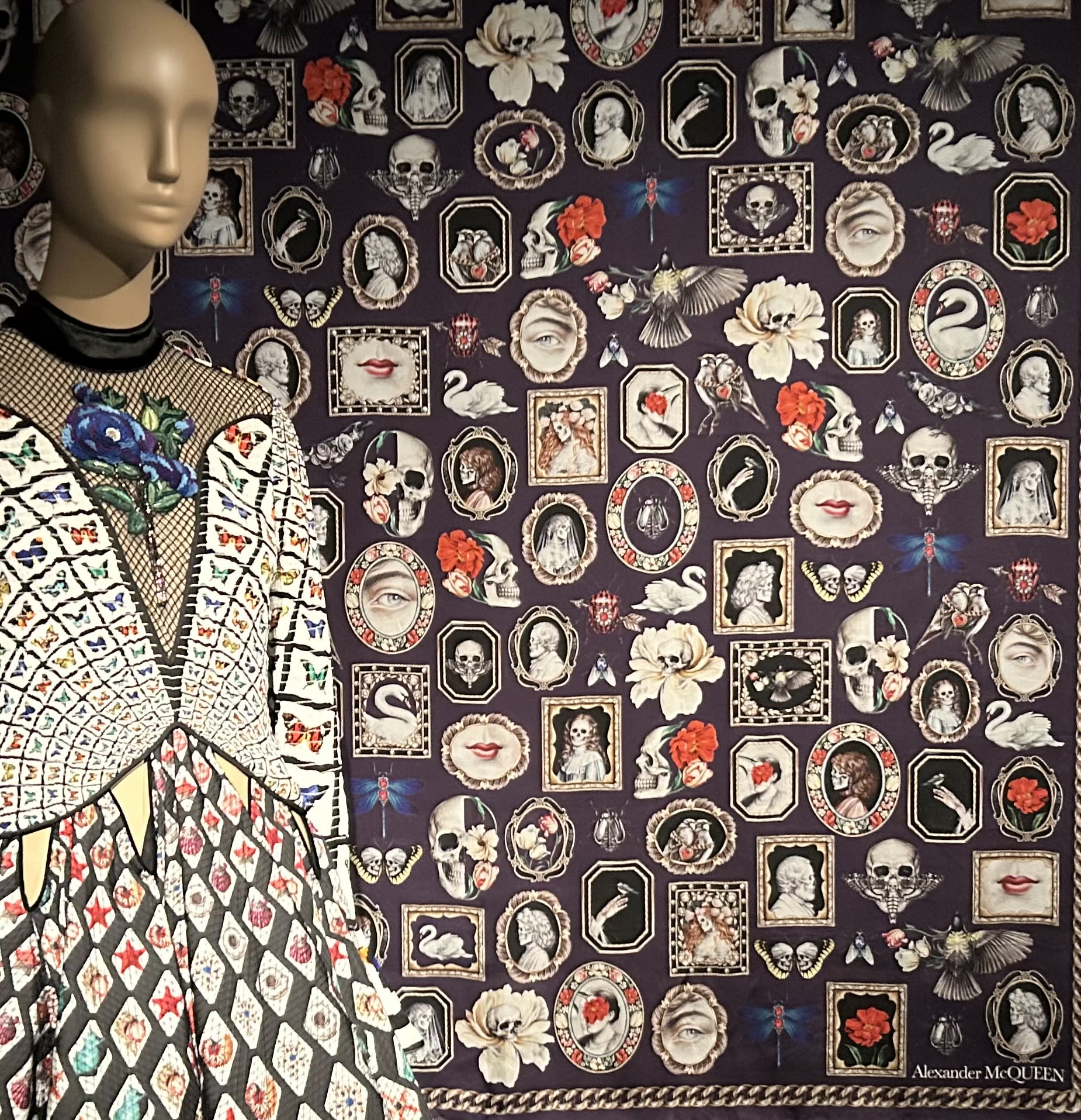 mannequin on display with cameos on the wall in the background