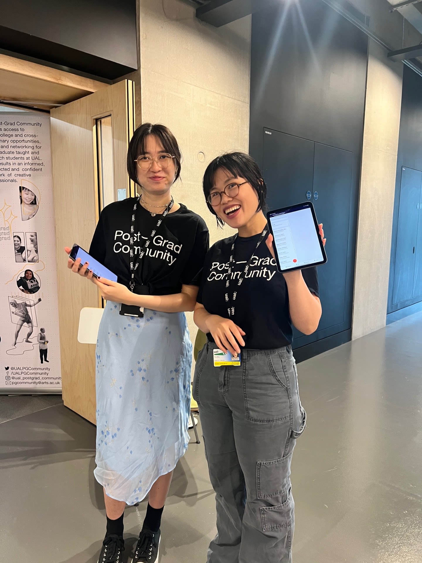 2 students smiling wearing ambassador tshirts