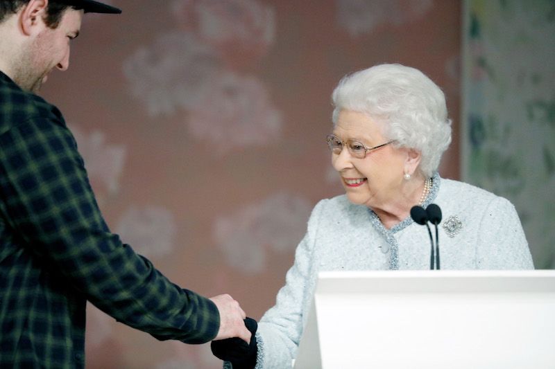 The Queen presenting an award to UAL alum Richard Quinn 