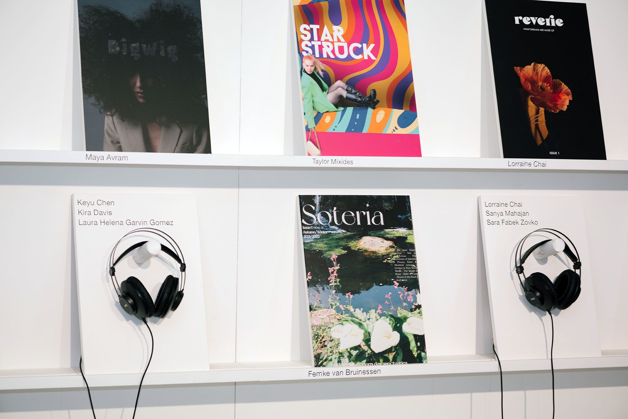 Magazines and headphones on a wall