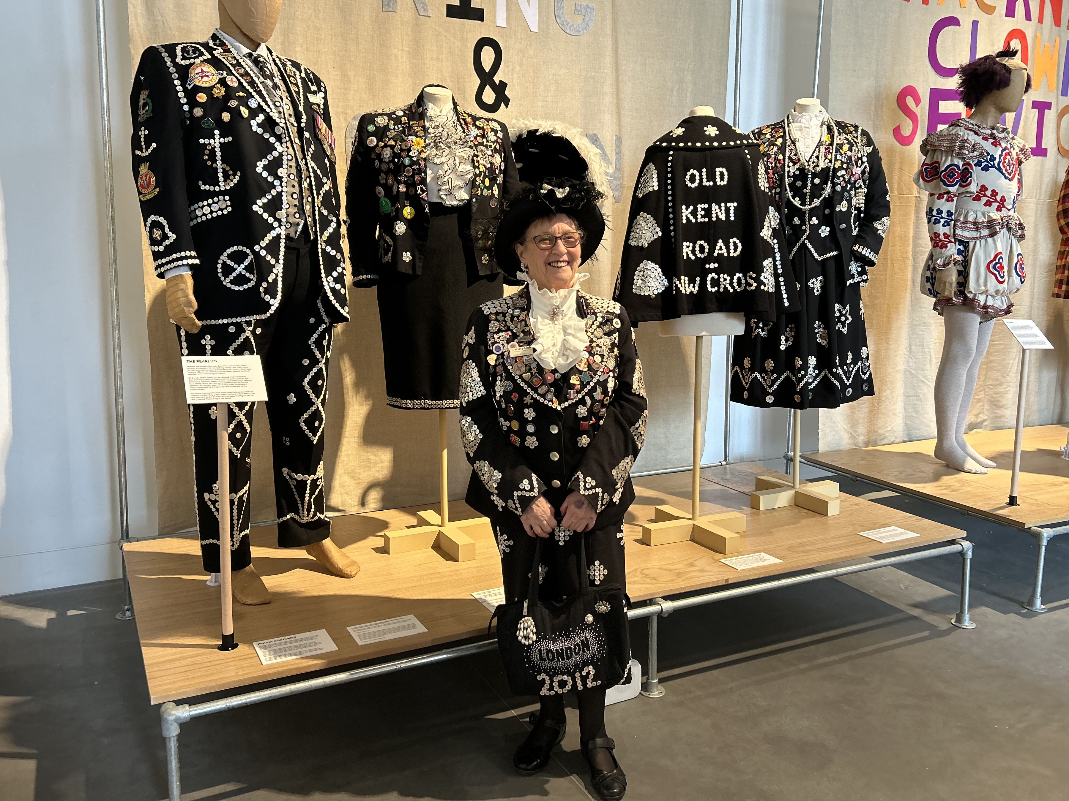 Doreen Pearly Queen standing infront of mannequins