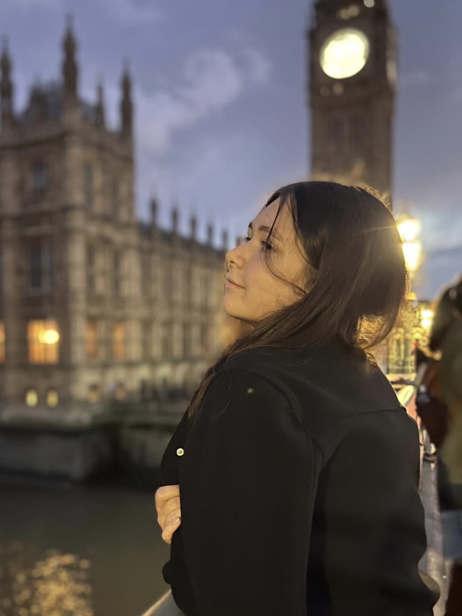 Woman standing with building in background
