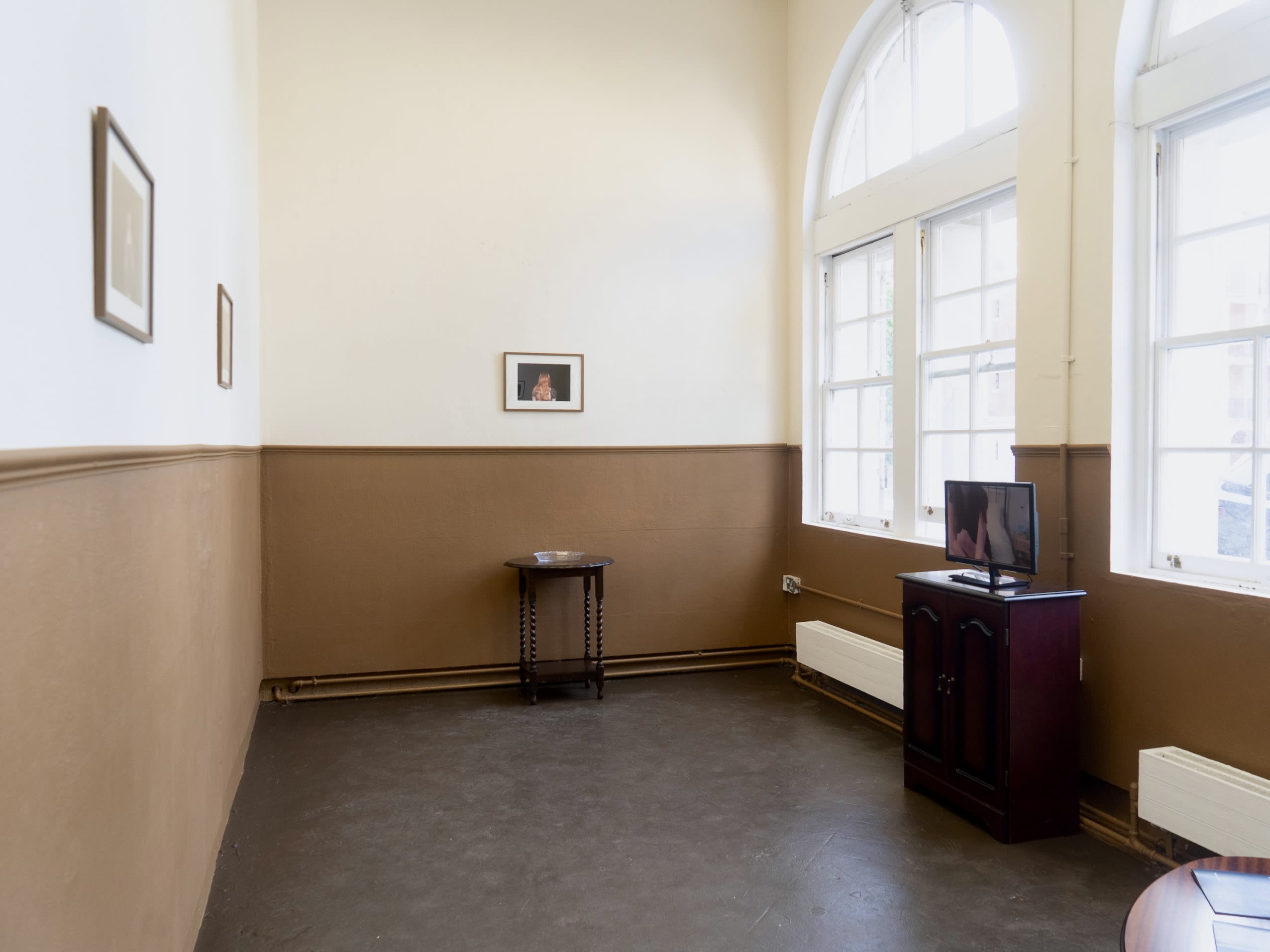 Room with photos and video playing