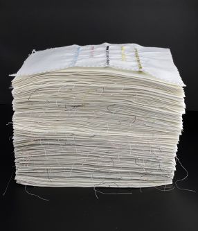 papers with hand highlighted text