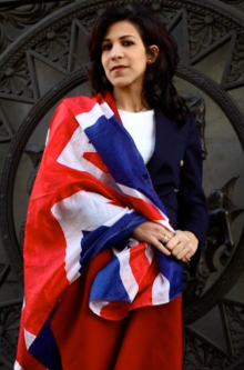 Woman wrapped with union jack flag.