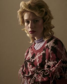 Model wearing positive knitwear