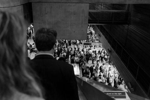 people in a crowd walking down a street