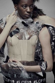 Two models hold one another in cellophane branded with LCF19.  
